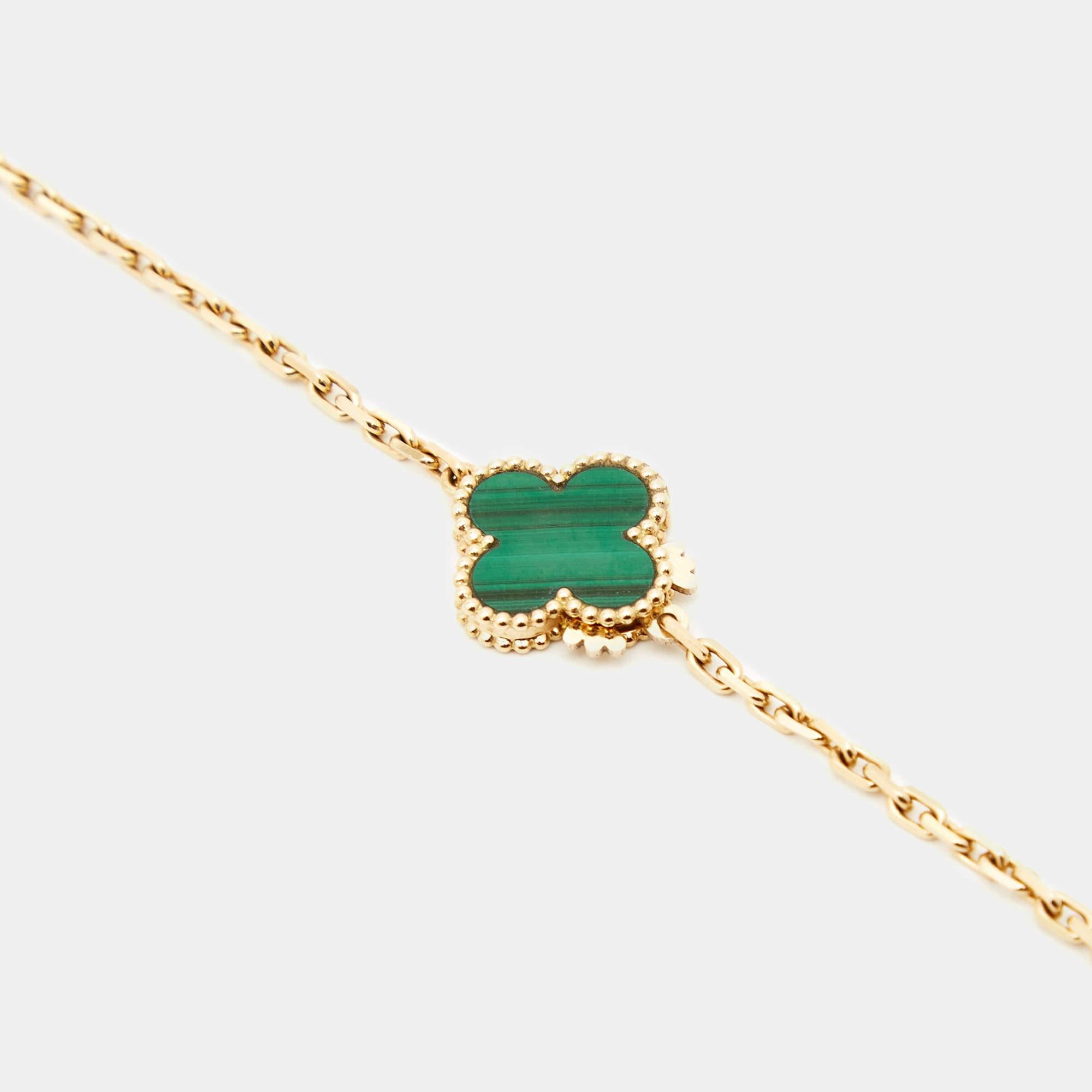 The Van Cleef & Arpels Magic Alhambra necklace is a stunning piece crafted in 18k yellow gold. Featuring the iconic Alhambra motifs with malachite inlays, the long necklace exudes elegance and sophistication, making it a timeless statement accessory