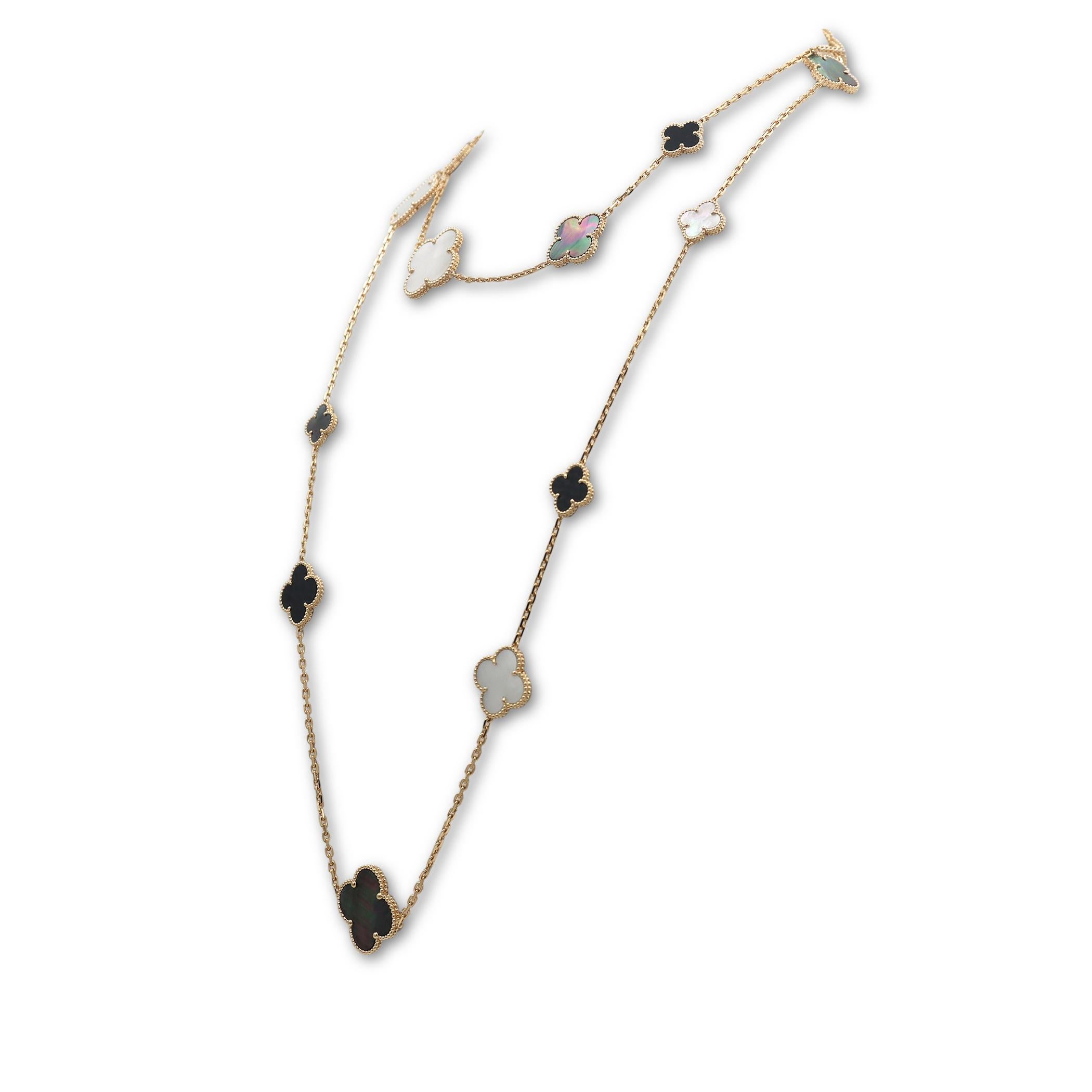 Authentic Van Cleef & Arpels 'Magic Alhambra' long necklace crafted in 18 karat yellow gold. Featuring a joyful mix of 16 clover-shaped onyx, white and gray mother-of-pearl motifs of varying sizes. The necklace measures 47.2 inches in length with