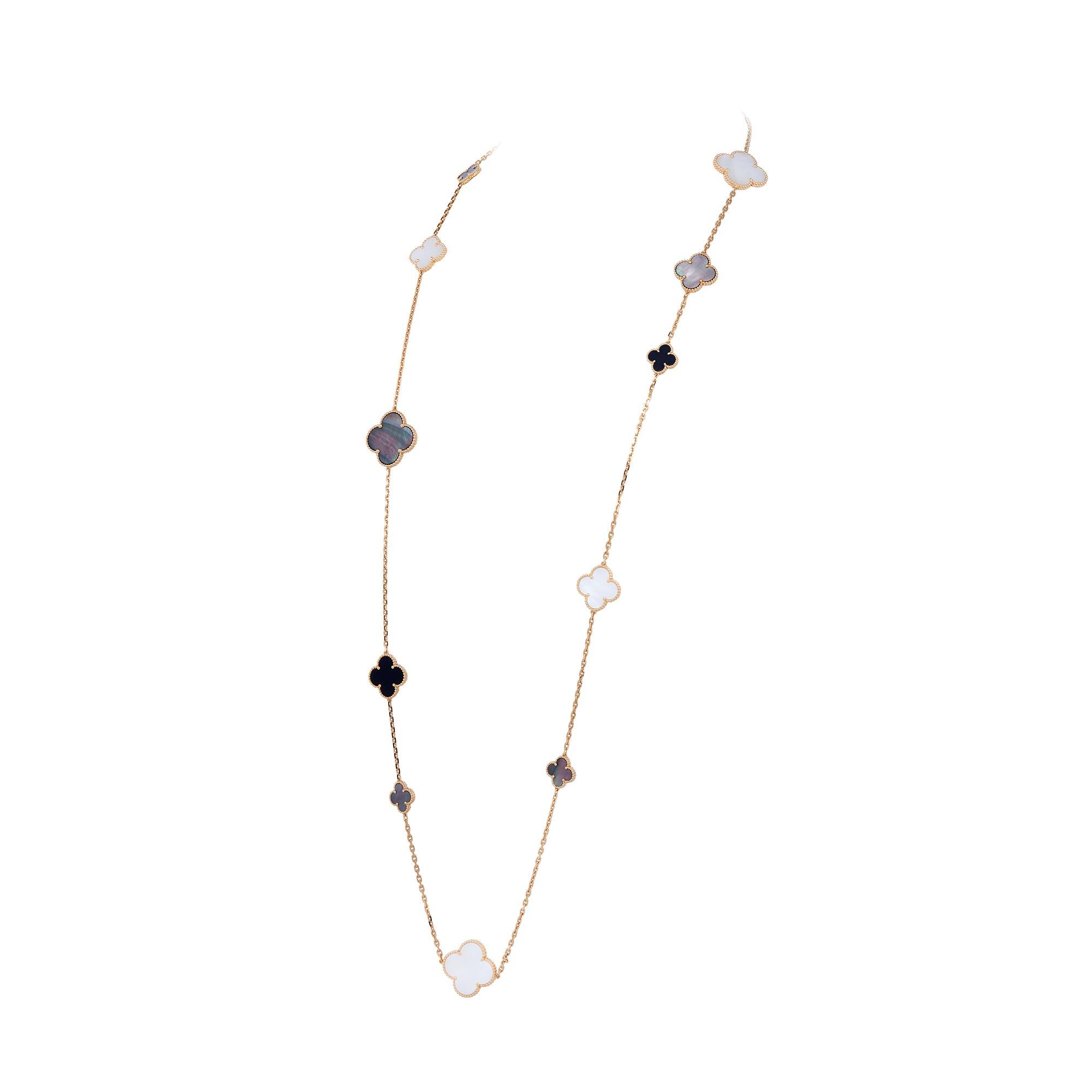 Authentic Van Cleef & Arpels 'Magic Alhambra' long necklace crafted in 18 karat yellow gold. Featuring a joyful mix of 16 clover-shaped onyx, white and gray mother-of-pearl motifs of varying sizes. The necklace measures 50.34 inches in length with