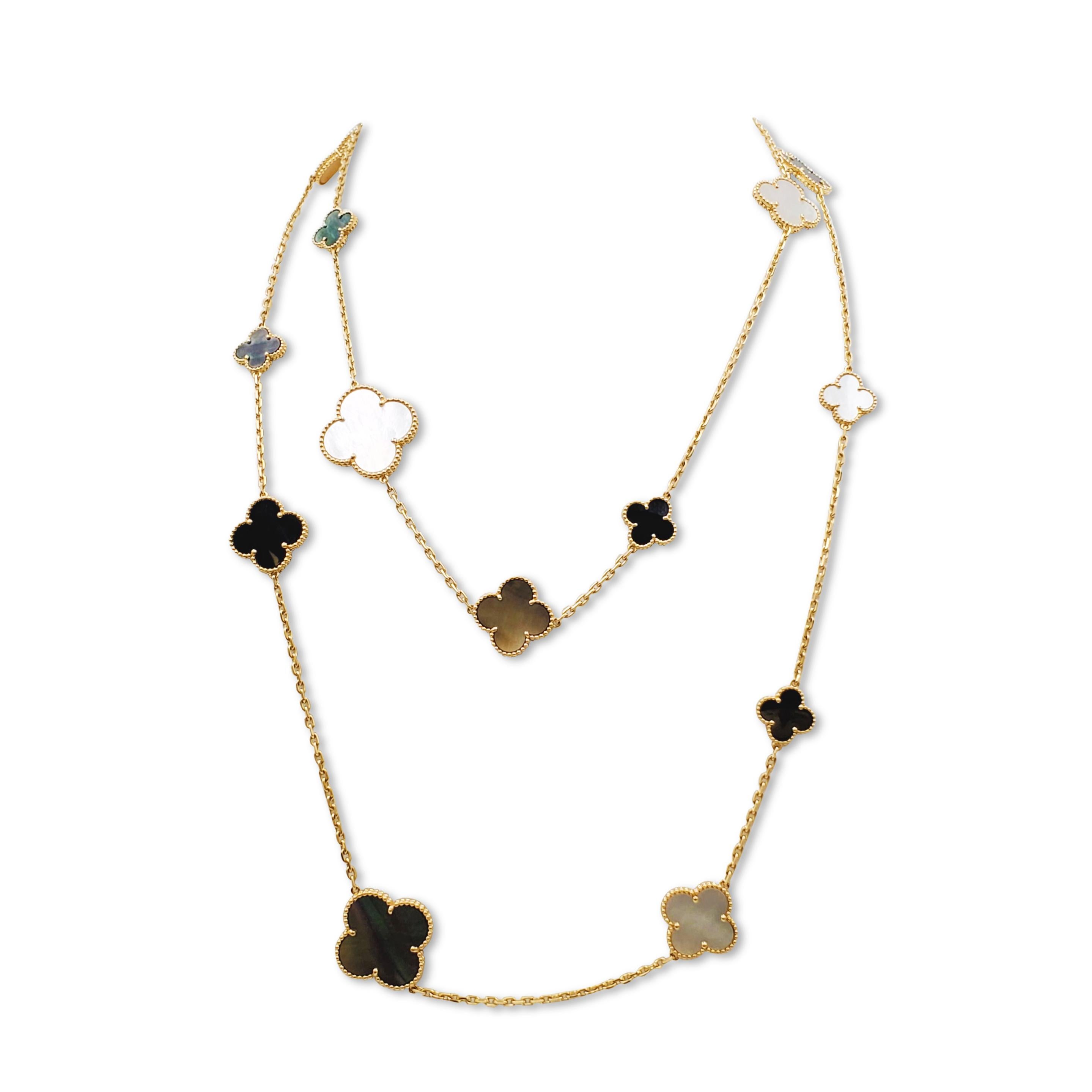 Authentic Van Cleef & Arpels 'Magic Alhambra' long necklace crafted in 18 karat yellow gold. Featuring a joyful mix of 16 clover-shaped onyx, white and gray mother-of-pearl motifs of varying sizes. The necklace measures 50.34 inches in length with