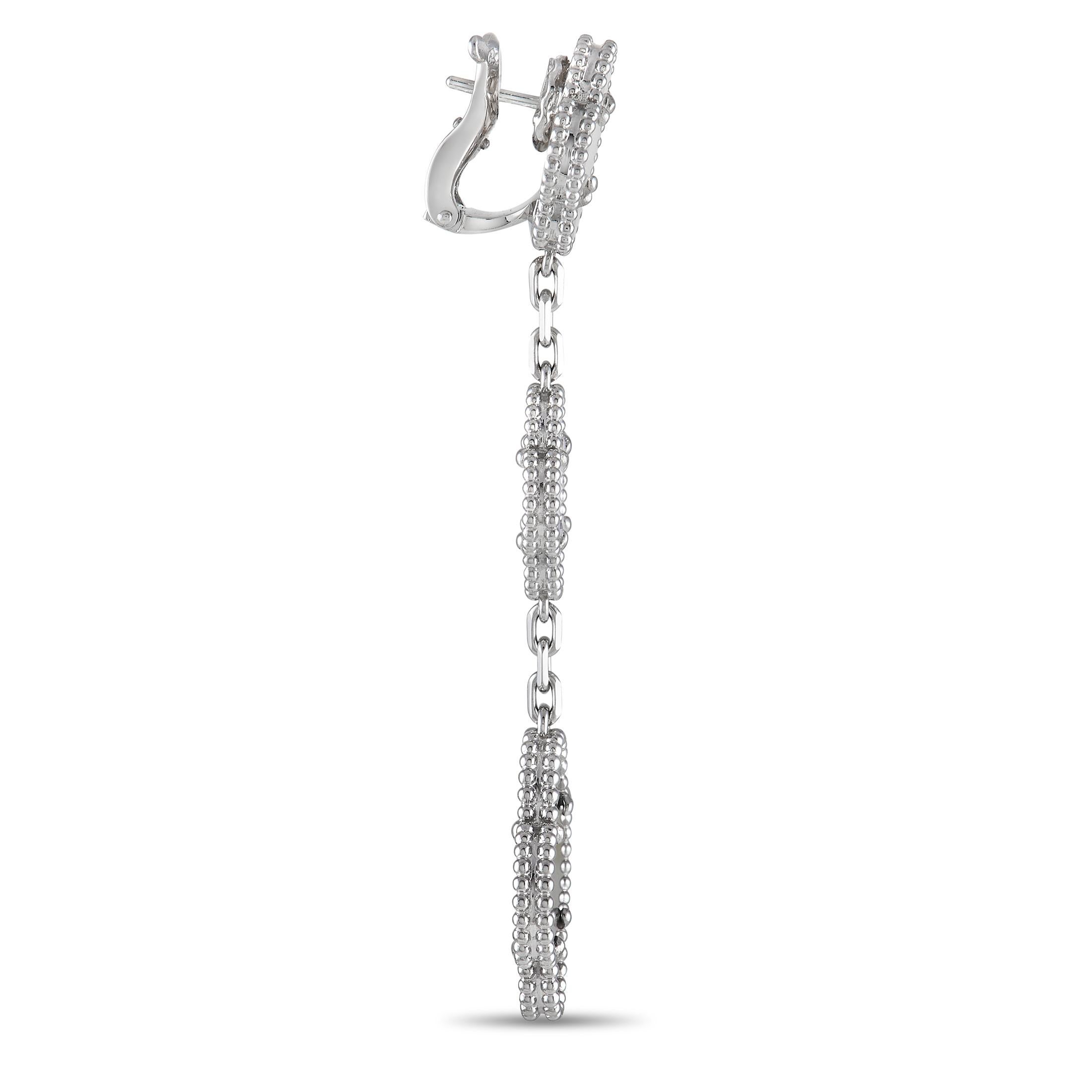 A mélange of luxurious materials come together to create these dynamic Van Cleef & Arpels Magic Alhambra earrings. Each one is crafted from 18K White Gold and features three iconic clover motifs accented by Grey Mother of Pearl, White Mother of