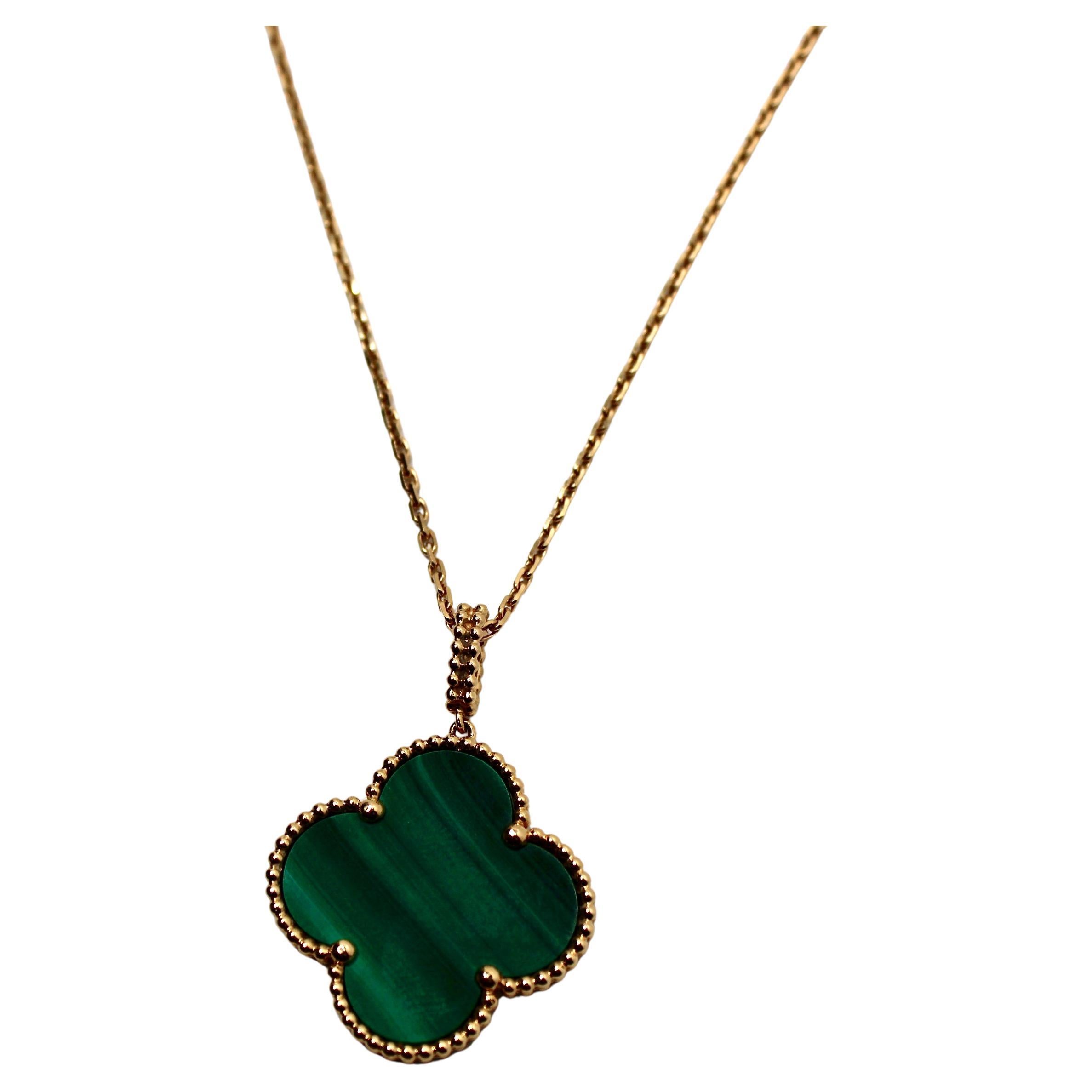 The Van Cleef 
Arpels Magic Alhambra 18k Yellow Gold 
Malachite Pendant Necklace is a stunning piece that embodies elegance and timeless charm. This is the larger pendant. Crafted from luxurious 18-karat yellow gold, the necklace features