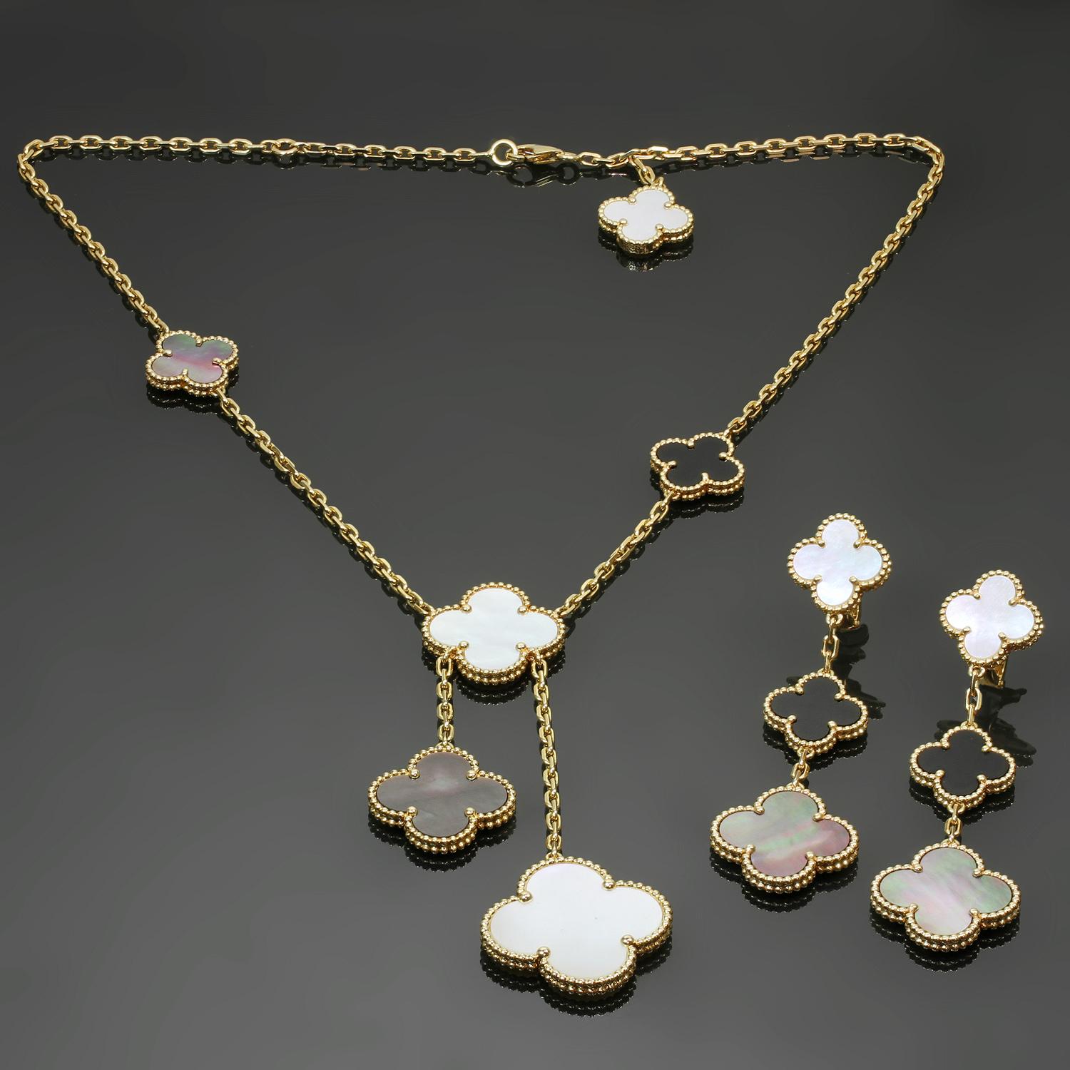 This stunning authentic Van Cleef & Arpels jewelry set from the iconic Magic Alhambra collection consists of a 6-motif necklace and matching 3-motif dangling earrings featuring the classic 4-leaf clover beaded design crafted in 18k yellow gold and