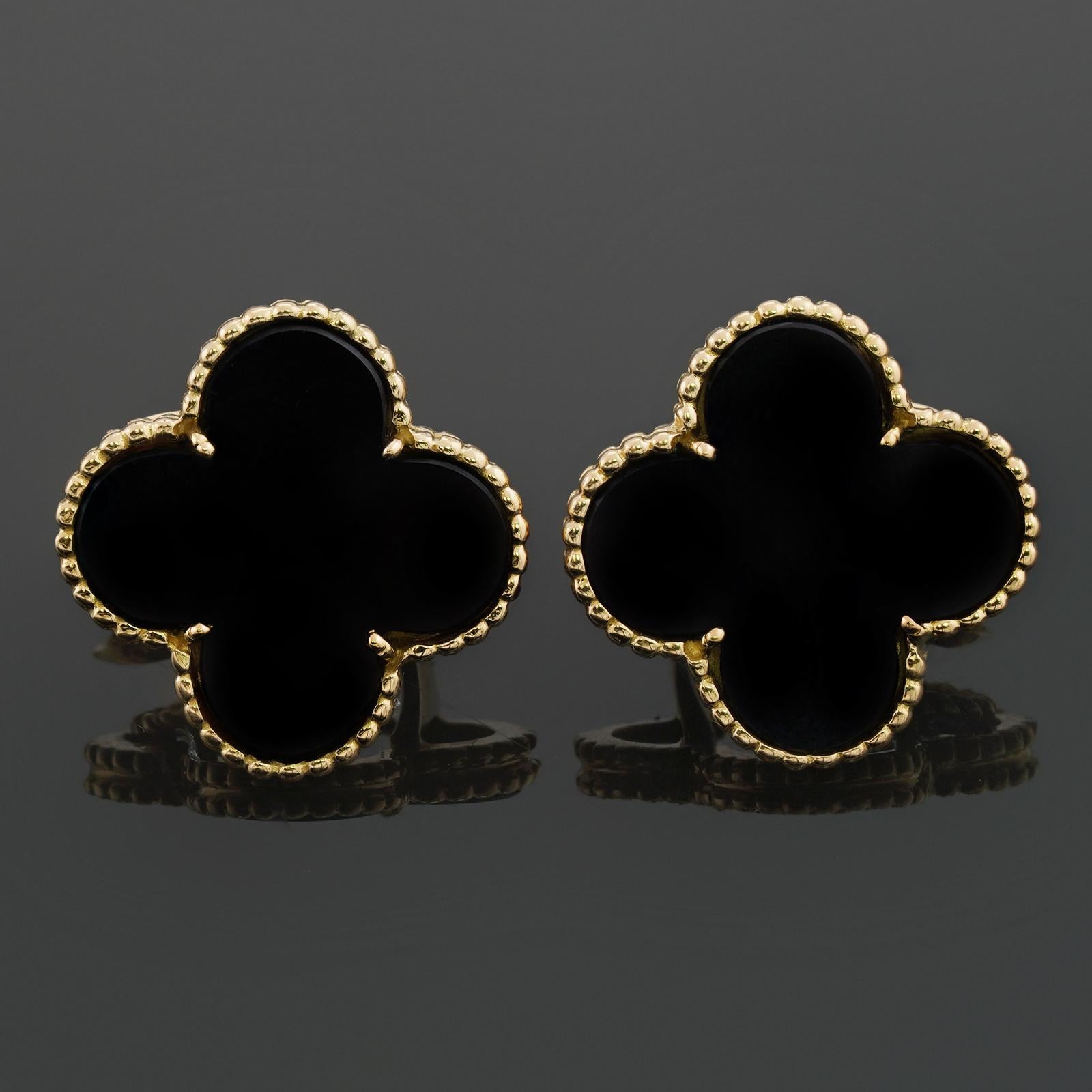 These iconic rare Van Cleef & Arpels clip-on earrings from the Magic Alhambra collection are crafted in 18k yellow gold and feature a pair of lucky clover motifs inlaid with black onyx round bead settings. Made in France circa 1990s. Posts can be