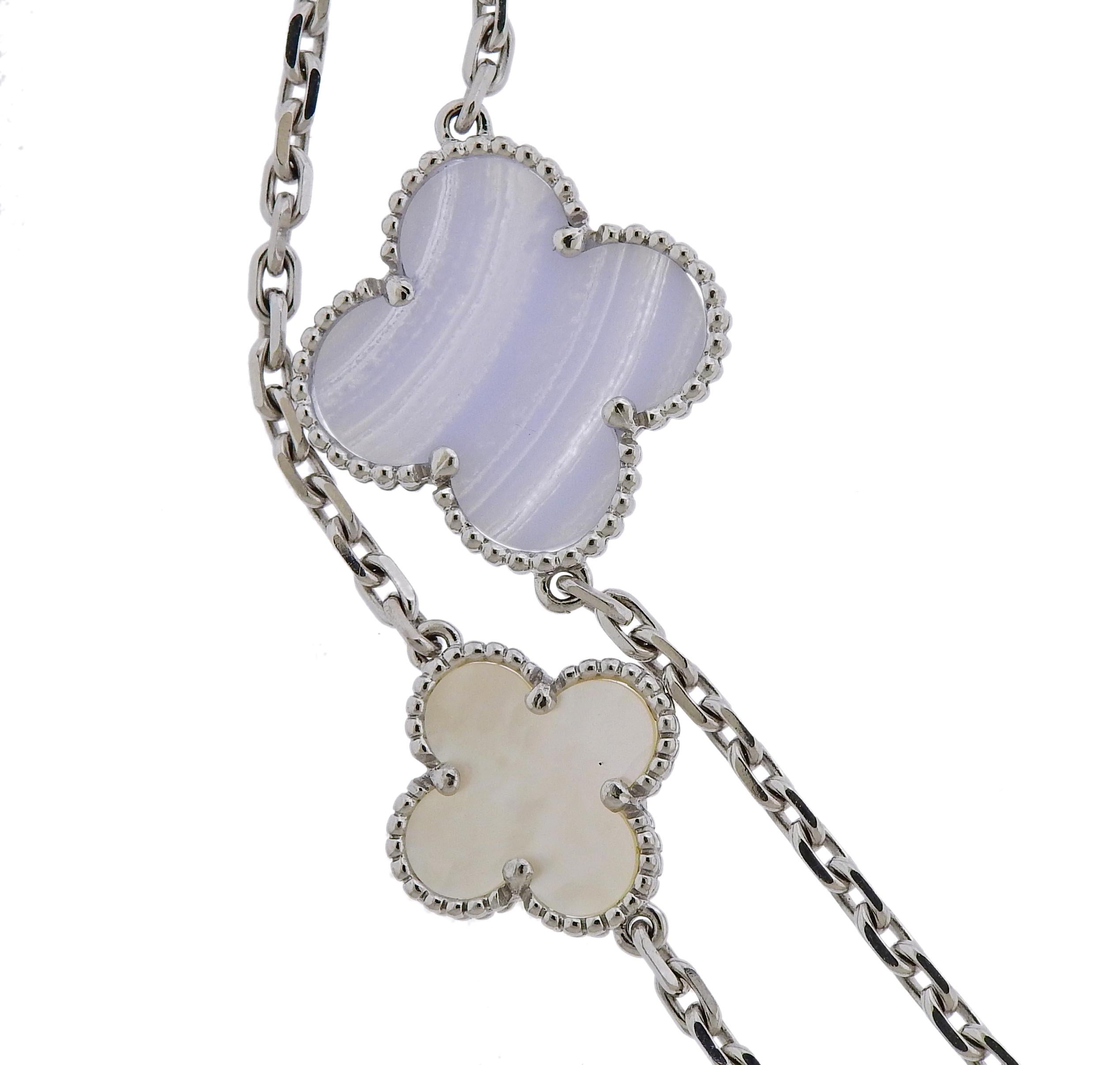 Long Magic Alhambra necklace by Van Cleef & Arpels, set with multi size clovers, set with mother of pearl and chalcedony, in 18k white gold. Necklace measures 48