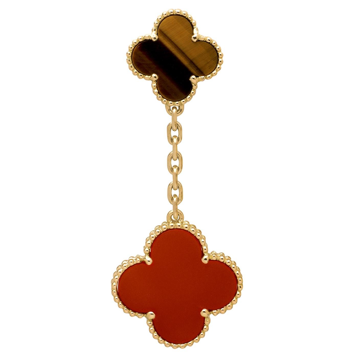 Magic Alhambra earrings, 2 motifs, 18K yellow gold, tiger’s eye, carnelian.

Details:
Brand: Van Cleef & Arpels
Model: VCARN5JR00
Style: Magic Alhambra Earrings
Stones: Carnelian: 2 stones, Tiger Eye: 2 stones (As each stone is unique, its color and