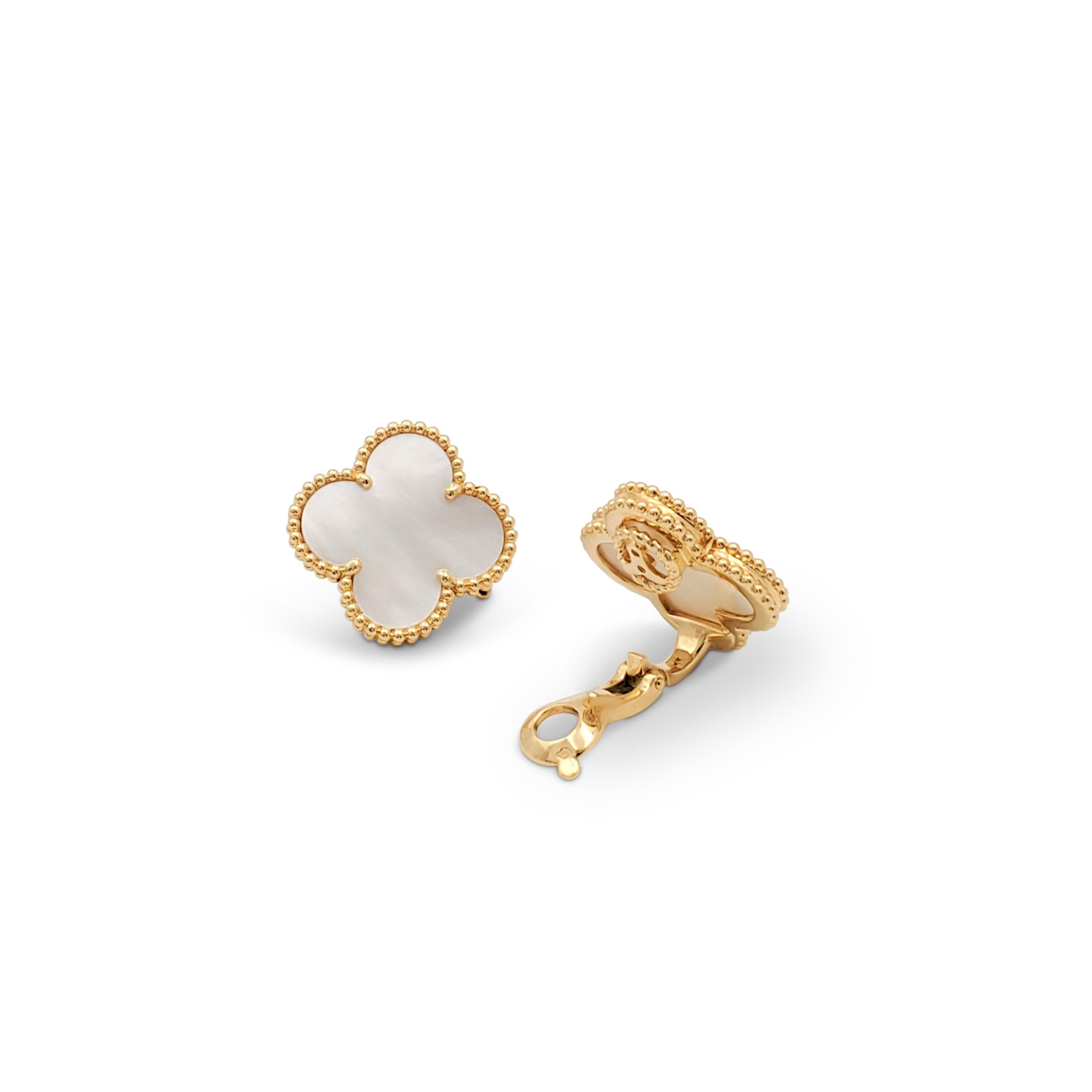 Authentic Van Cleef & Arpels 'Magic Alhambra' earrings crafted in 18 karat yellow gold centering on the brand's iconic mother-of-pearl clover motif. Signed VCA, Au750, with serial number. Clip backs, without earring posts. The earrings are presented