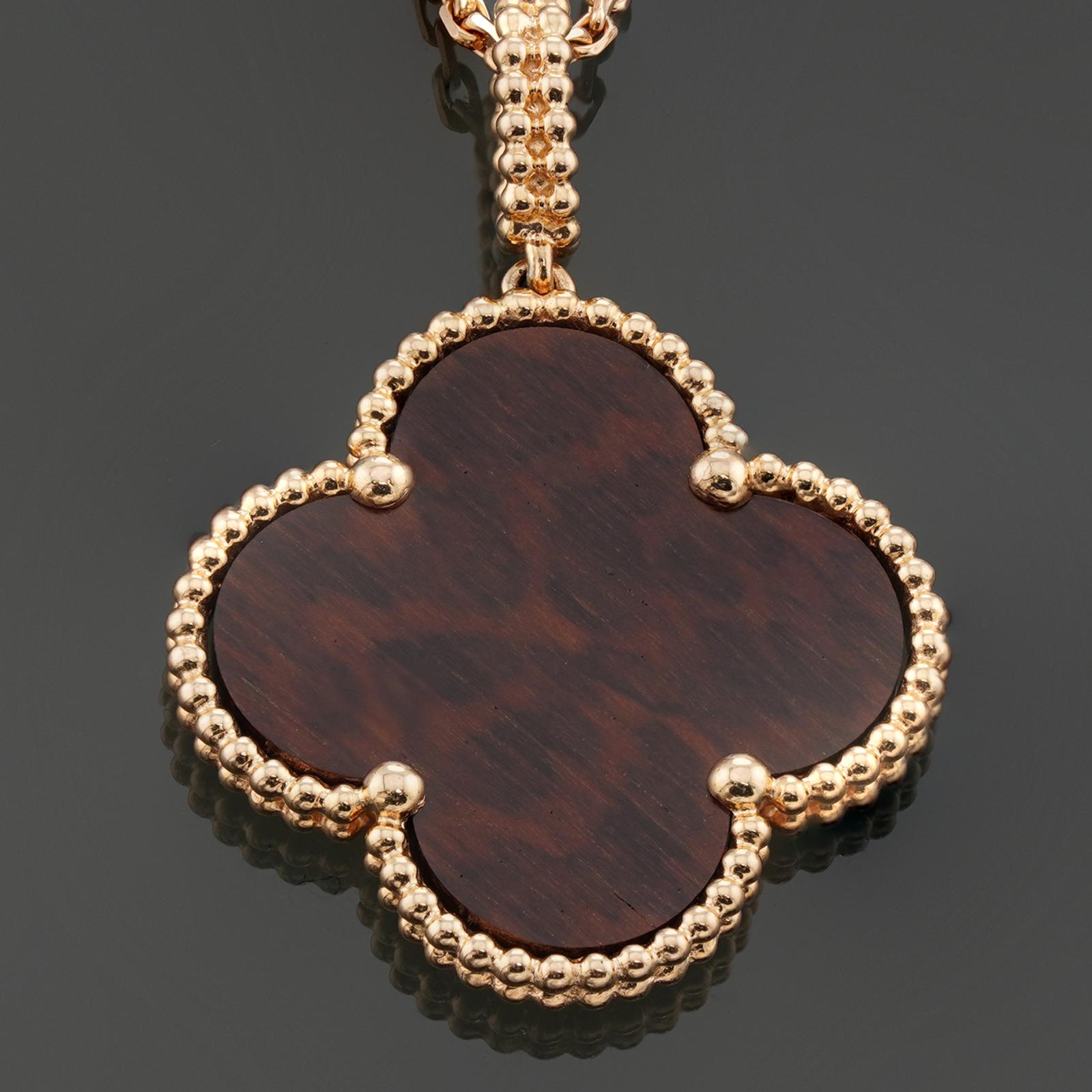 This gorgeous Van Cleef & Arpels necklace is crafted in 18k rose gold and features a letterwood pendant. The Magic Alhambra collection inspired by lucky four-leaf clovers and the scalloped archways of the Alhambra Palace. Made in France circa 2000s.