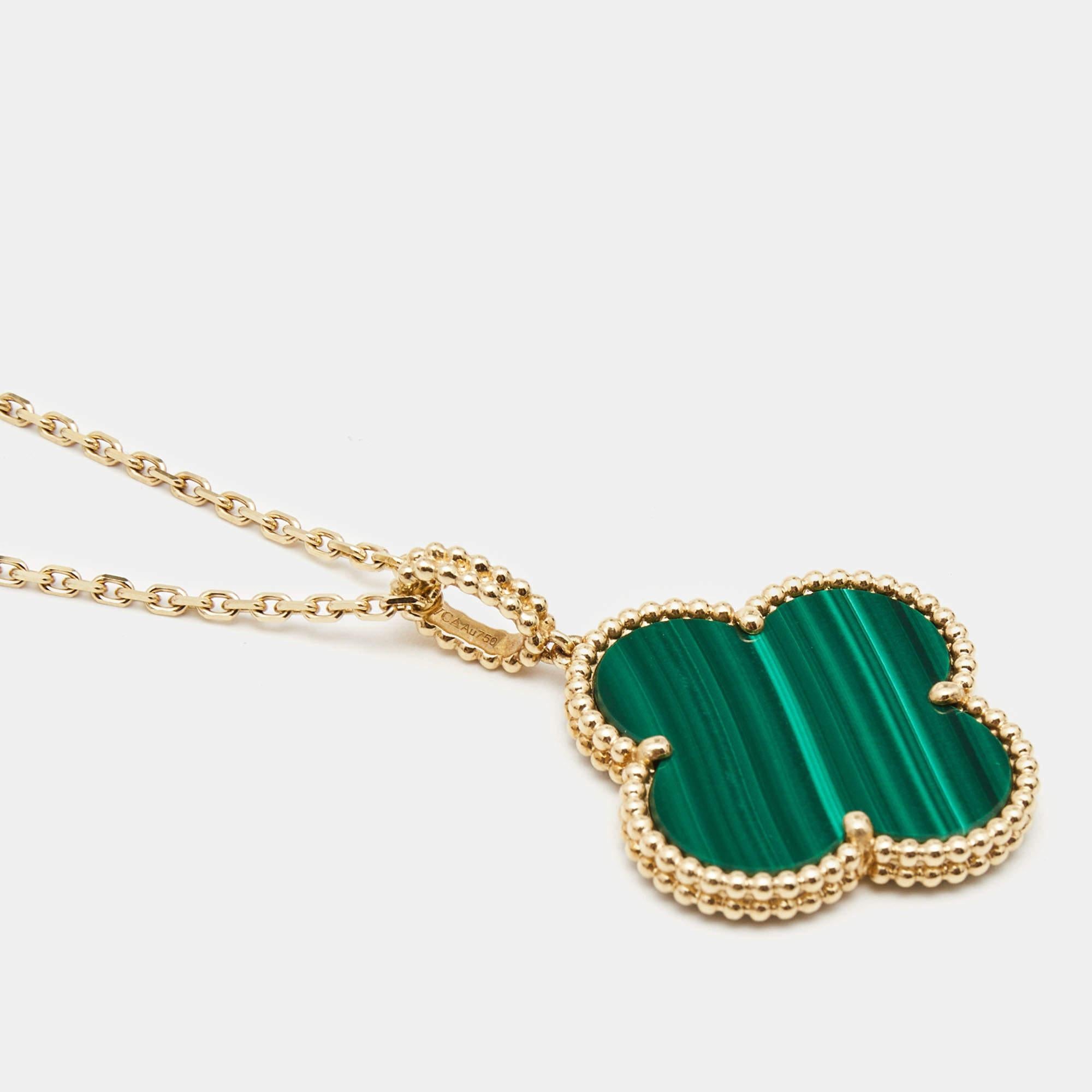 The Van Cleef & Arpels Magic Alhambra necklace exudes timeless elegance. Crafted from lustrous 18k yellow gold, it features the iconic Alhambra motif adorned with stunning malachite, a deep green semi-precious gemstone. This exquisite piece