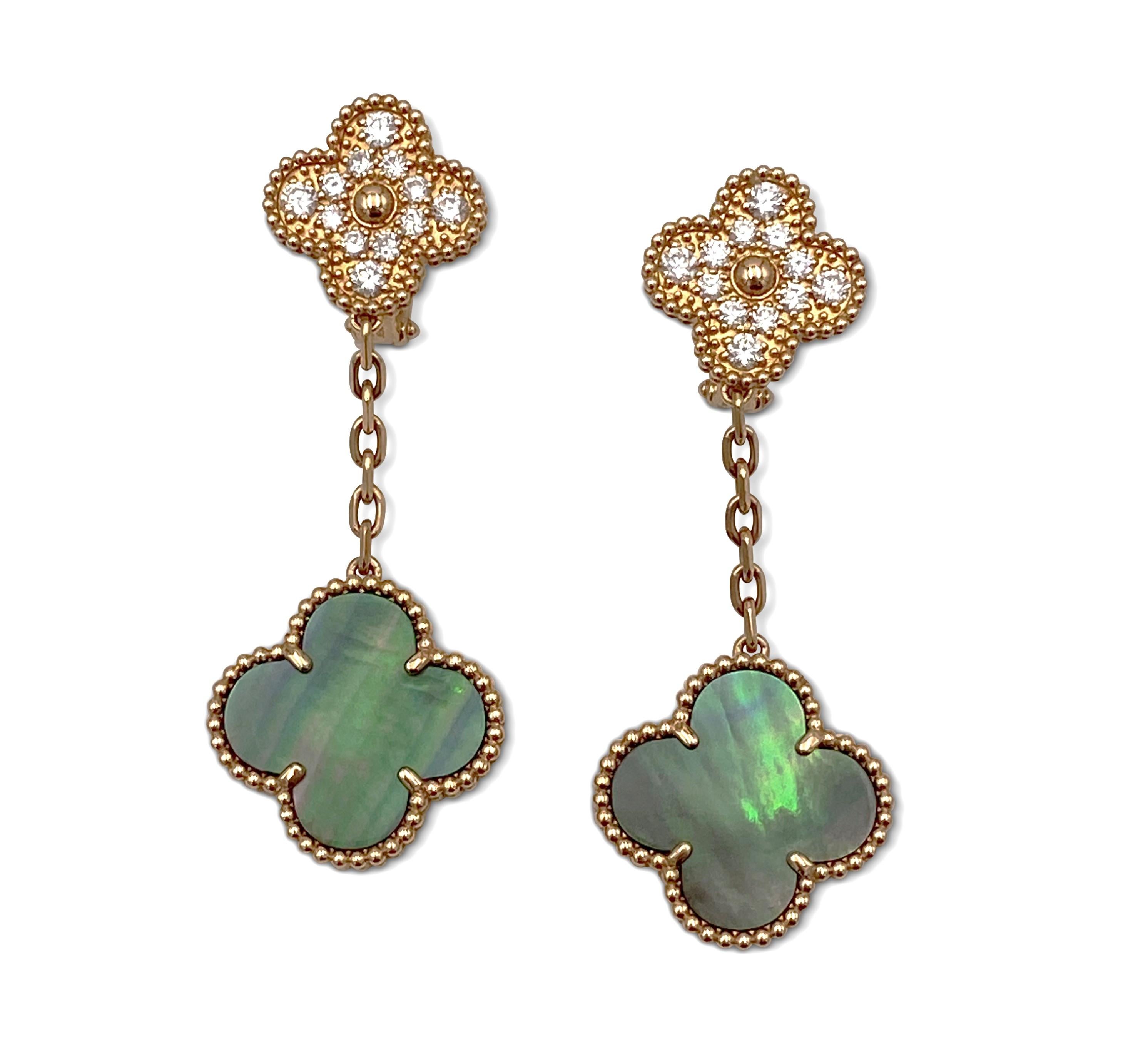 Authentic Van Cleef & Arpels 18 karat rose gold diamond and mother-of-pearl two motif Alhambra long earrings. Inspired by the clover leaf, the earrings asymmetric design feature different-sized Alhambra motifs made from different materials. The top