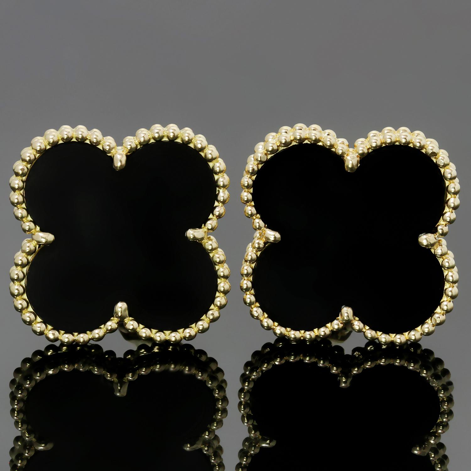 These elegant Van Cleef & Arpels drop earrings from the Magic Alhambra collection are crafted in 18k yellow gold and feature a pair of lucky clover motifs inlaid with black onyx round bead settings. Made in France circa 2012. Measurements: 0.78