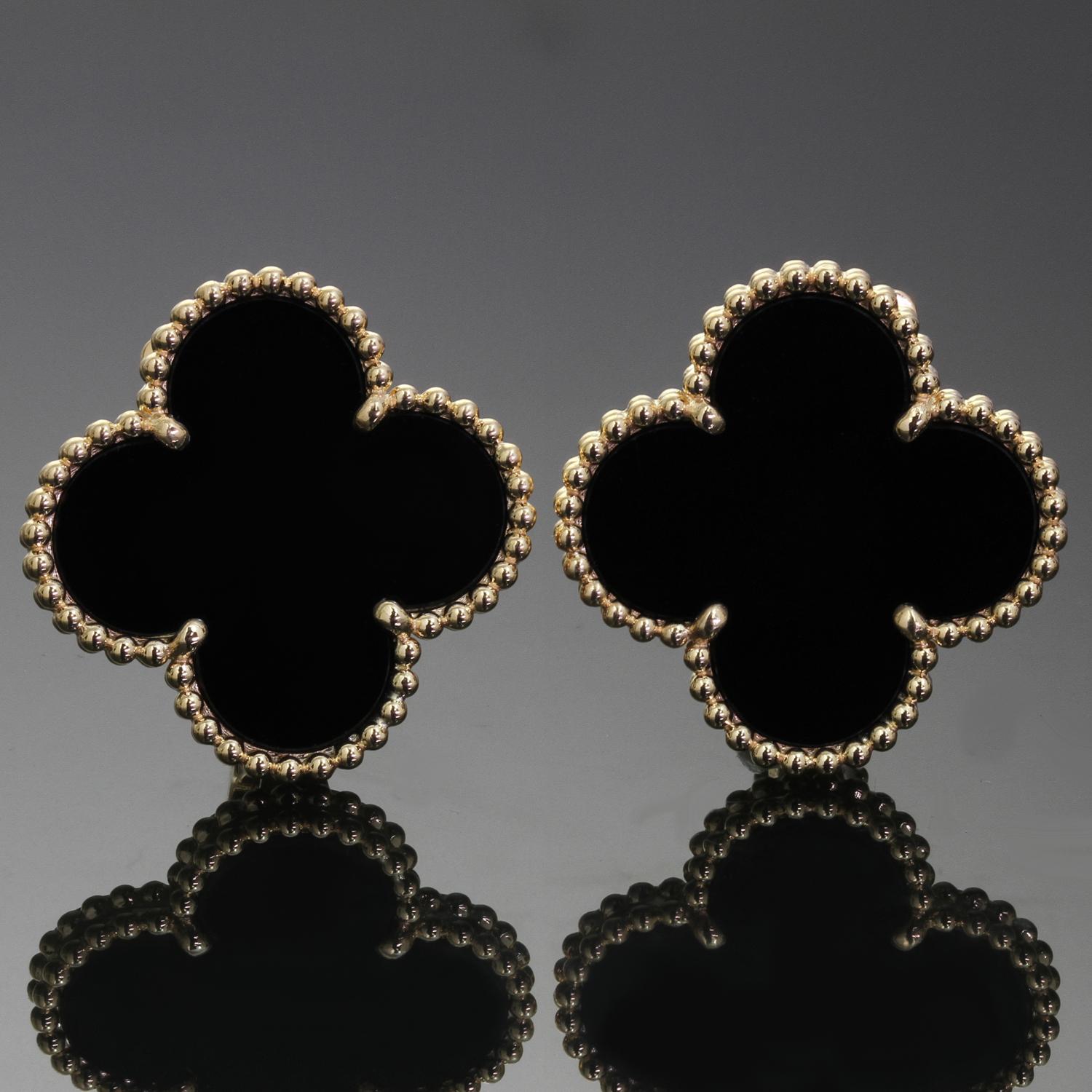 These elegant Van Cleef & Arpels drop earrings from the Magic Alhambra collection are crafted in 18k yellow gold and feature a pair of lucky clover motifs inlaid with black onyx in round bead settings. Made in France circa 2012. Excellent condition.