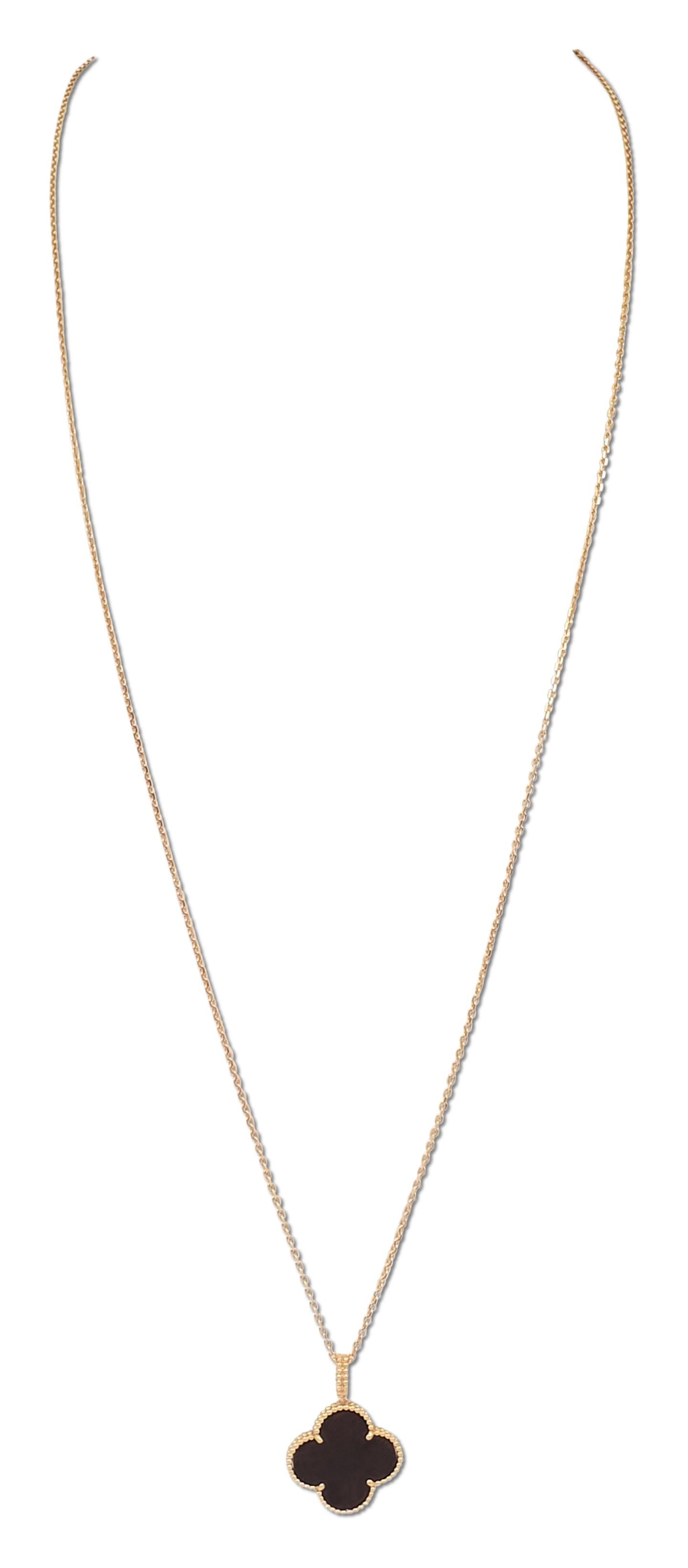 Authentic Van Cleef & Arpels Magic Alhambra long necklace features a single clover motif pendant crafted in 18 karat rose gold and set with carved wood. The pendant measures 26 x 26mm and hangs from a 90cm 18 karat rose gold chain. The necklace can
