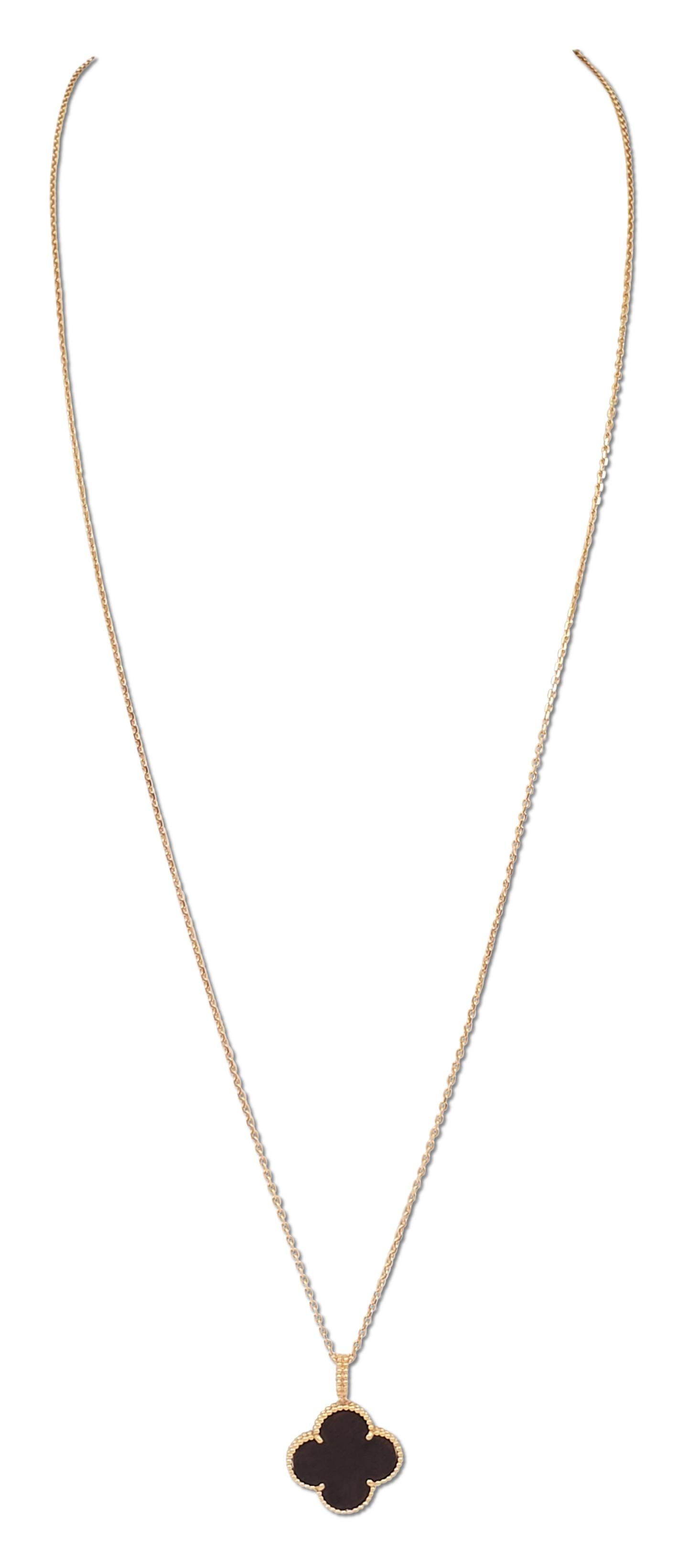 Authentic Van Cleef & Arpels Magic Alhambra long necklace features a single clover motif pendant crafted in 18 karat rose gold and set with carved wood. The pendant measures 26 x 26mm and hangs from a 90cm 18 karat rose gold chain. The necklace can