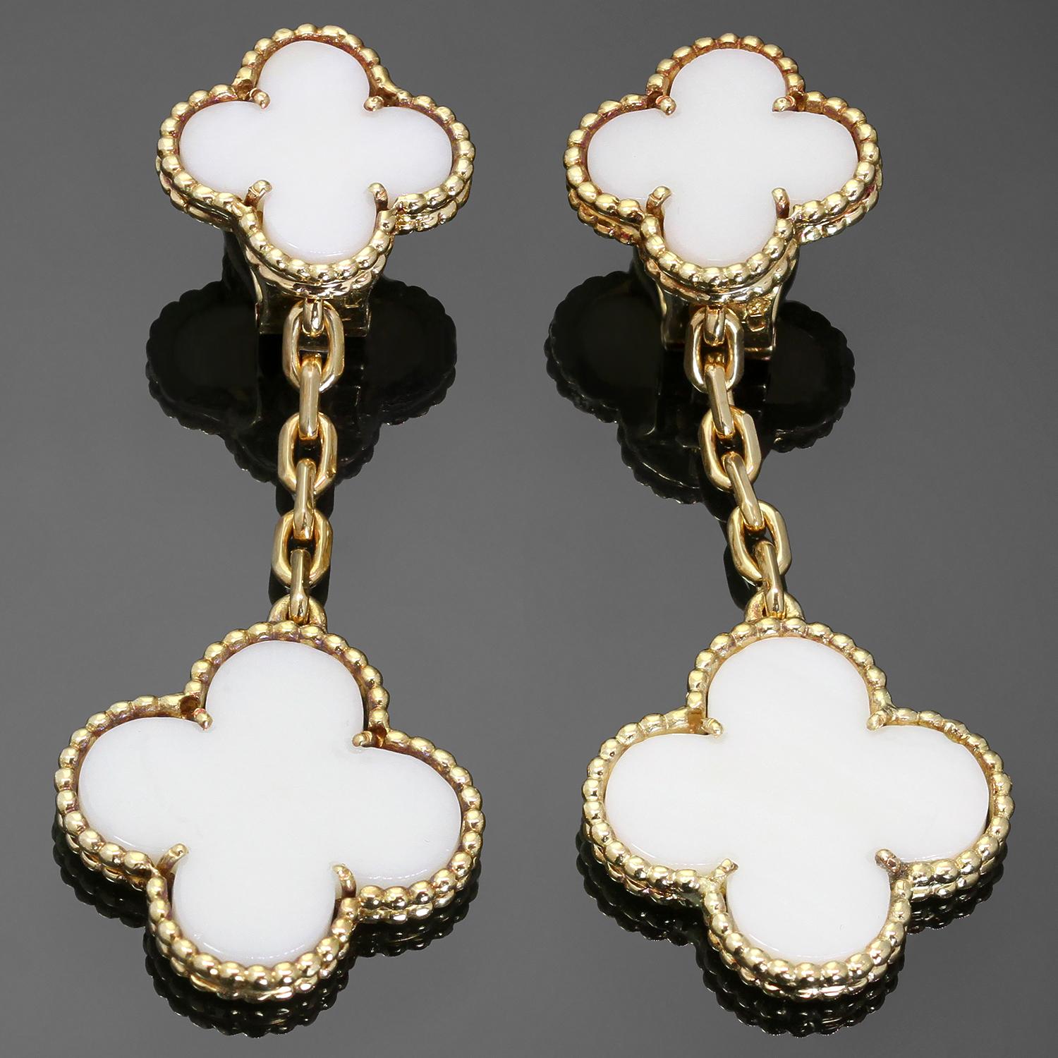 These elegant vintage Van Cleef & Arpels drop earrings from the Magic Alhambra collection are crafted in 18k yellow gold and feature lucky clover motifs inlaid with white corals in round bead settings. Made in France circa 1970s. Measurements: 0.78