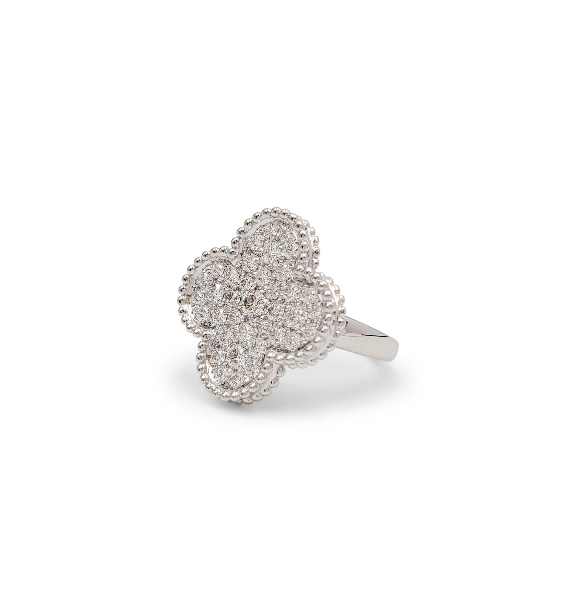 Authentic Van Cleef & Arpels 'Magic Alhambra' ring crafted in 18 karat white gold centering on a cover motif set with an estimated 1.07 carats of round brilliant cut diamonds (E-F, VS). Signed VCA, Au750, 50, with serial number. The ring is