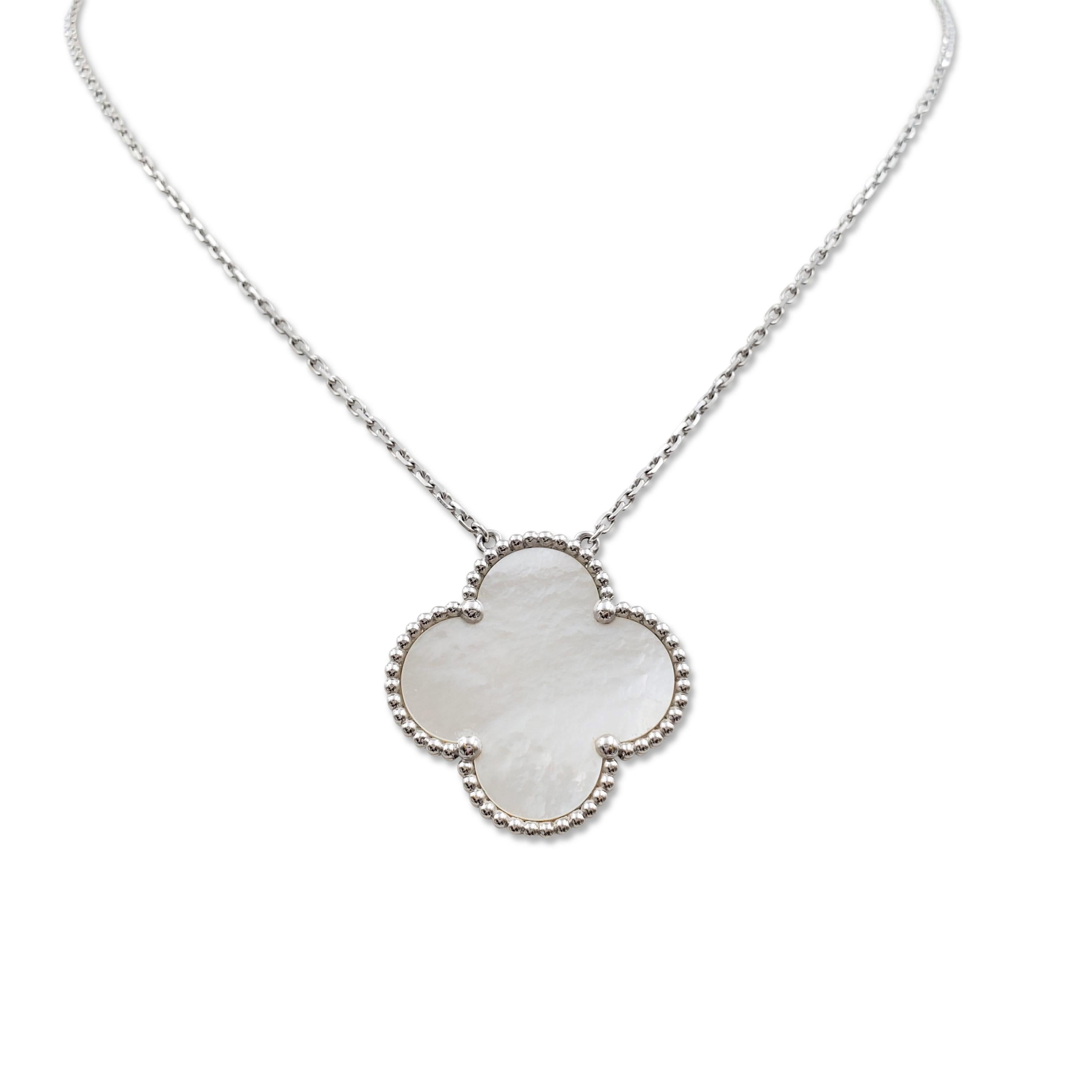 Authentic Van Cleef & Arpels 'Magic Alhambra' pendant necklace crafted in 18 karat white gold features a single cloverleaf inspired motif in iridescent mother-or-pearl. Signed VCA, Au750, with serial number and hallmark. The necklace is presented