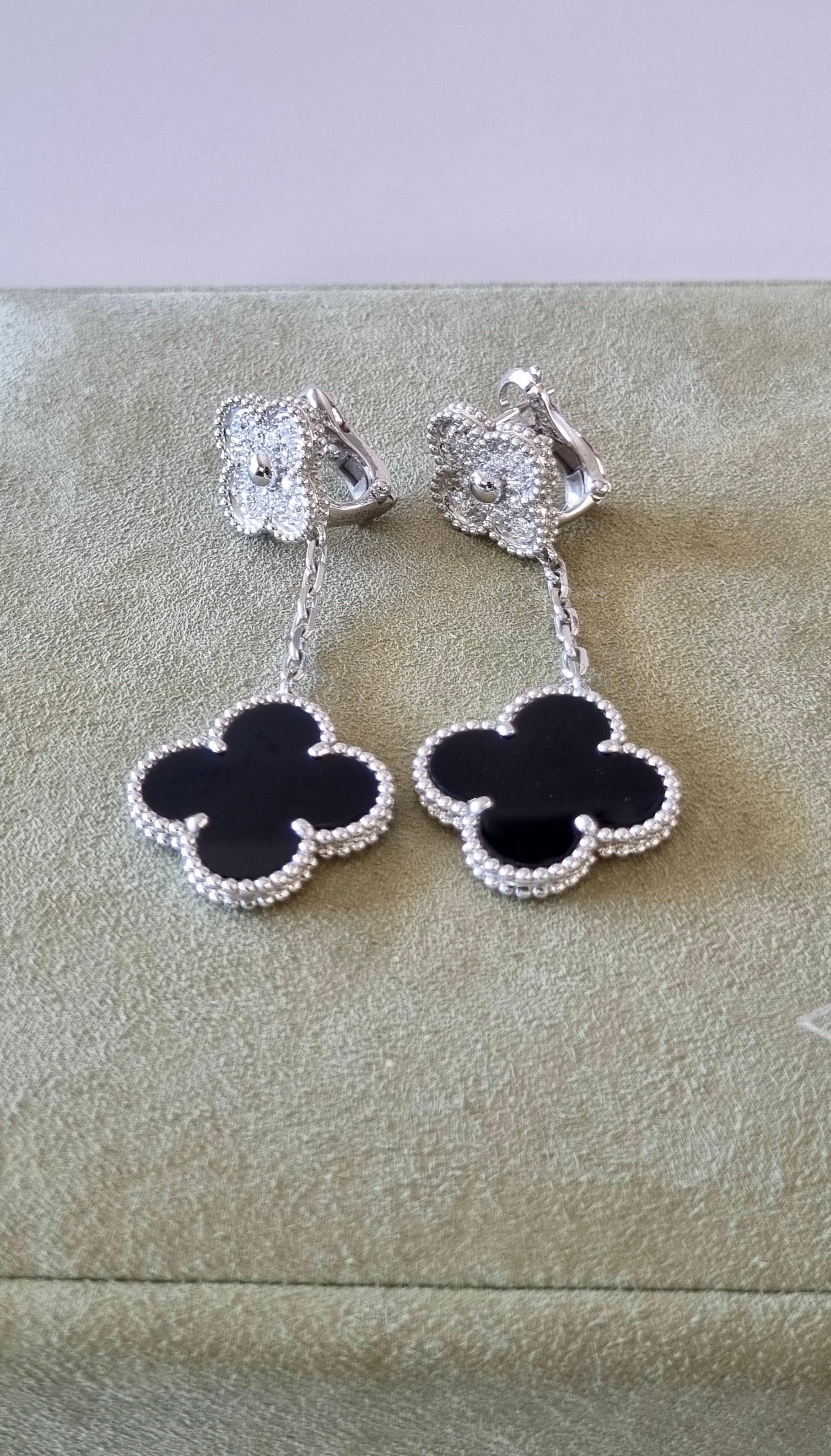 Magic Alhambra White Gold Onyx and Diamonds Earrings
This earrings are not original Van Cleef & Arpels
The are an inspiration and design alike
Diamond: 24 stones, 0.97 carat
Onyx: 2 stones
Clip back with detachable stem in 18K white gold, option to