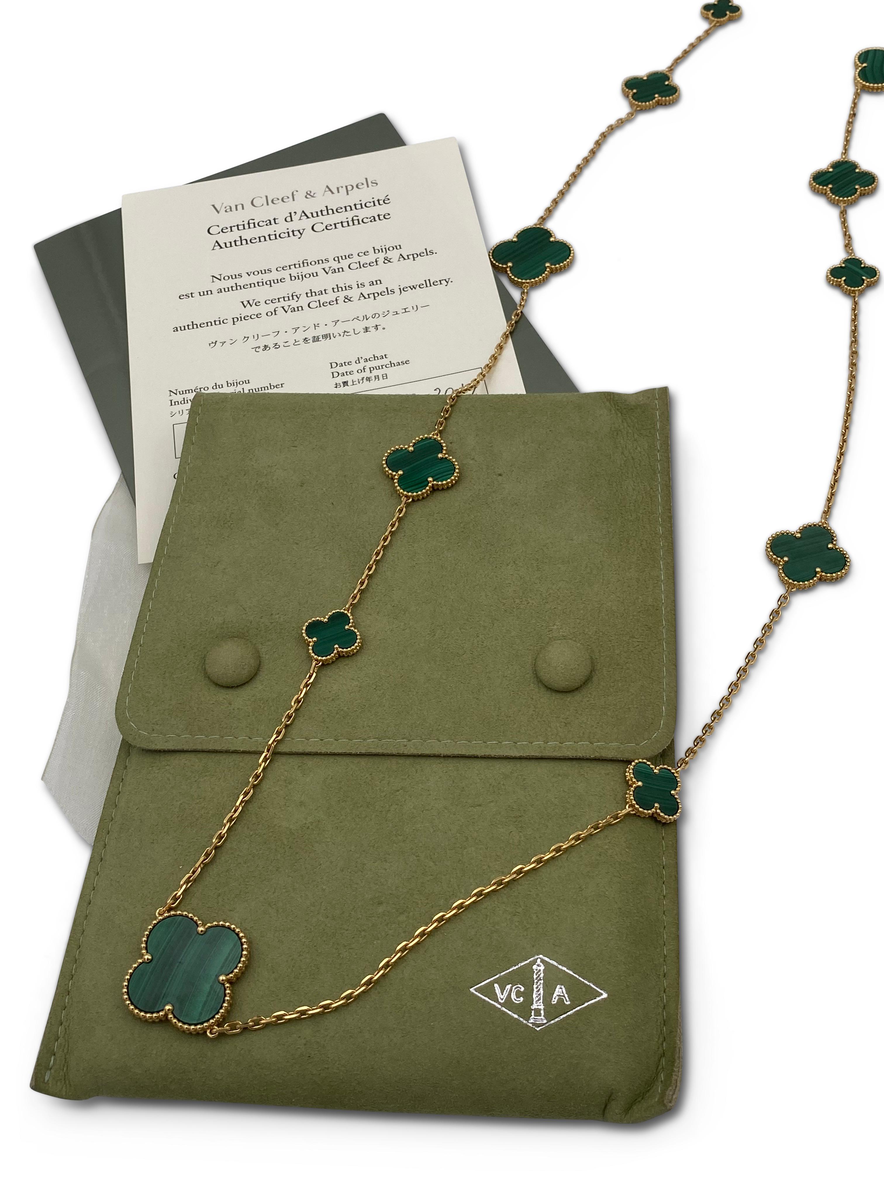 Authentic Van Cleef & Arpels 'Magic Alhambra' necklace crafted in 18 karat yellow gold featuring 16 clover leaf inspired motifs of malachite stones. Signed VCA, Au750, with hallmarks. Measures 50 3/4 inches in length. The necklace is presented with