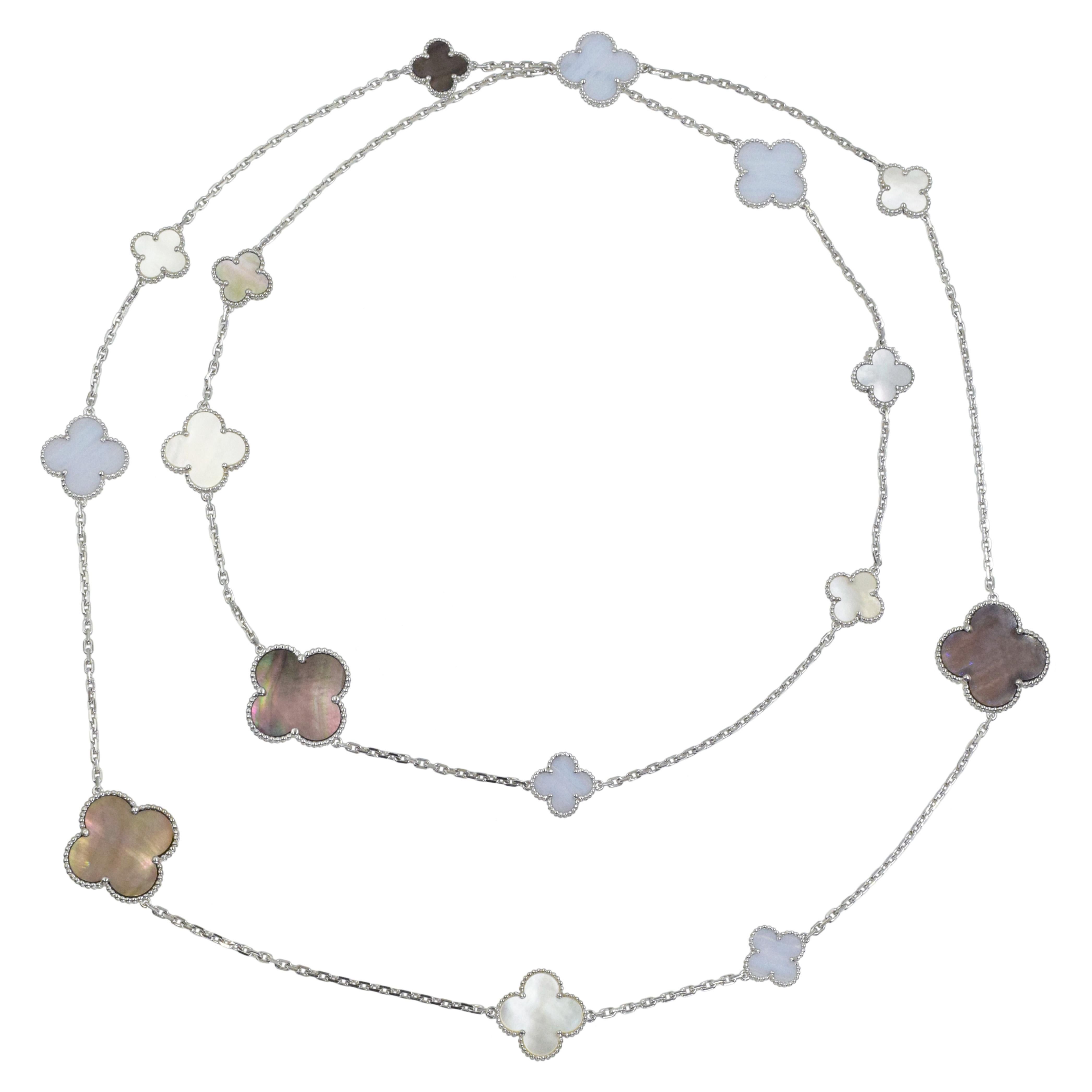 Van Cleef & Arpels MOP and Chalcedony 16 motif necklace in 18k white gold. The necklace features  5 gray  Mother of Pearl clover motifs, 6 white Mother of Pearl clover motifs, and 5 blue chalcedony clove  motifs. Motifs measure: 15mm, 20mm and 26mm.
