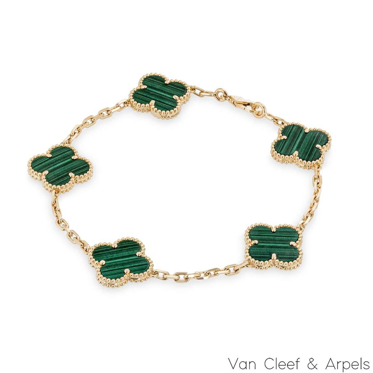 A gorgeous 18k yellow gold malachite bracelet by Van Cleef & Arpels, from the Vintage Alhambra collection. The bracelet features 5 iconic 4 leaf clover motifs, each with a beaded edge and a malachite inlay. The bracelet measures 7.5 inches in
