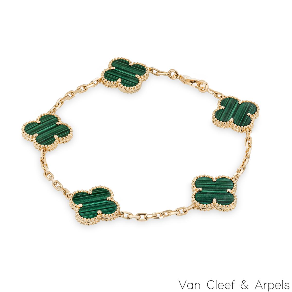 A gorgeous 18k yellow gold malachite bracelet by Van Cleef & Arpels from the Vintage Alhambra collection. The bracelet features 5 iconic 4 leaf clover motifs, each set with a beaded edge and a malachite inlay, set throughout the length of the chain.
