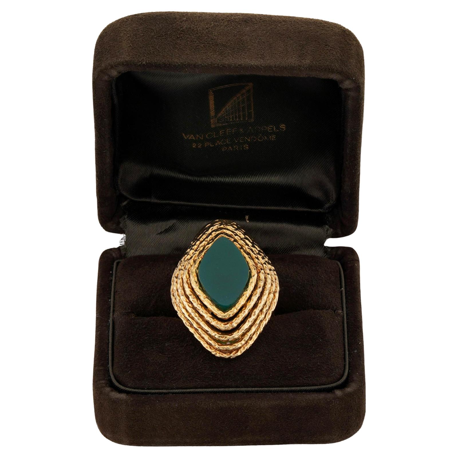 This gorgeous rare Van Cleef & Arpels cocktail ring features a marquise design crafted in 18k textured yellow gold and set with a marquise-cut green chalcedony. Made in France circa 1970s. Measurements: 0.98