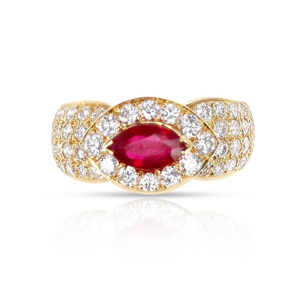 A Van Cleef & Arpels Marquise Ruby and Diamond Ring made in 18 Karat Yellow Gold. The center ruby is a marquise shape and is accented by round diamonds. The ring size is 6.50 US. Made in France. 

SKU: 1127-RDCTEYA


