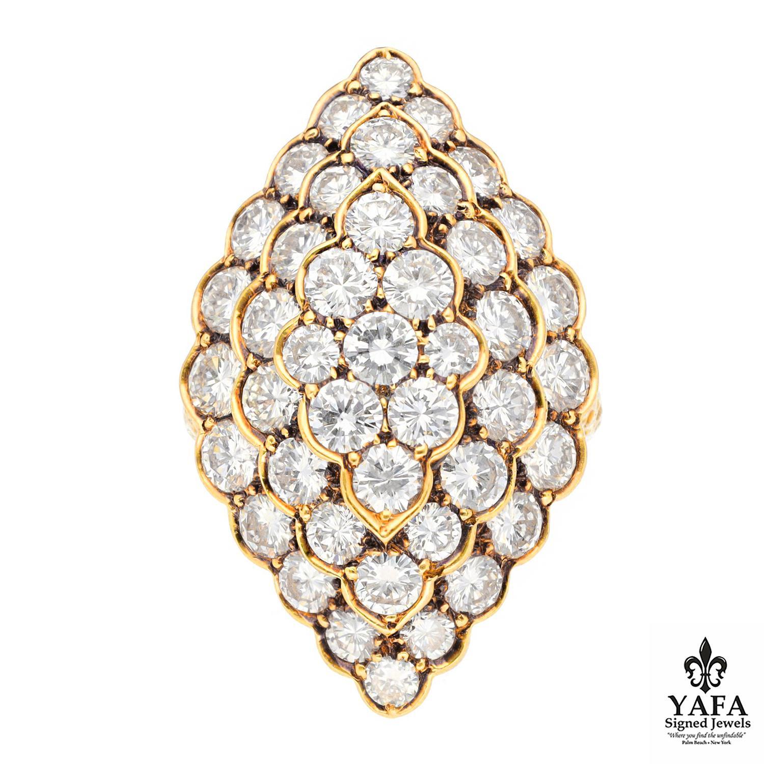 Van Cleef & Arpels Marquise Shaped Scalloped Design Ring.
43 Round Brilliant Diamonds and Hammered Shank.
Circa - 1980's
Size - 5.25
18K Yellow Gold
Signed - VCA