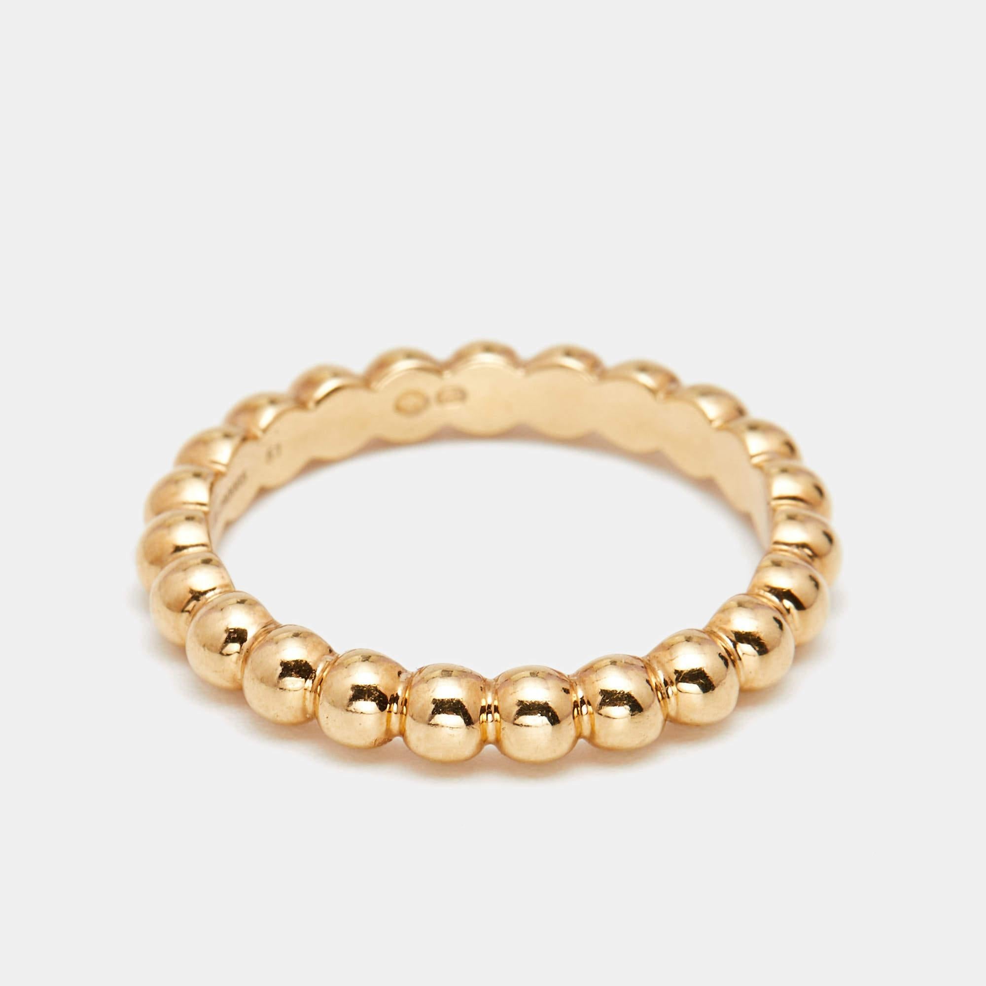 This sleek and classic Perlée ring from the house of Van Cleef & Arpels has been expertly crafted in 18k yellow gold. It comes with an all-over bead detailing. Wear it as a stand-alone ring or stacked with similar band rings for a chic look.

