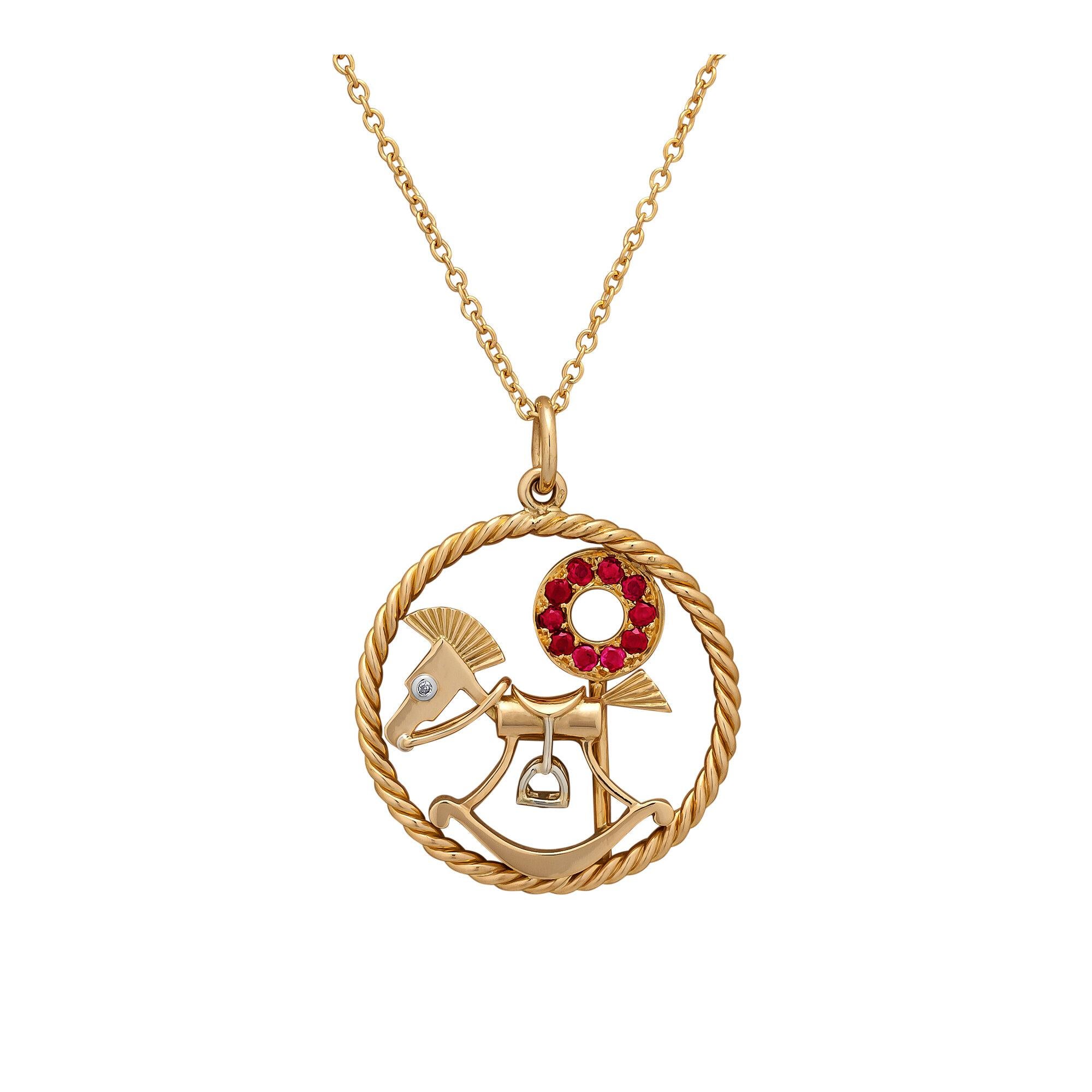 Keep calm and rock on with this Van Cleef & Arpels Paris mid-century diamond ruby gold rocking horse charm pendant.  Featuring a multi-dimensional diamond eyed rocking horse and a ruby flavored lollipop, this circa 1955 charm has a twisted circular
