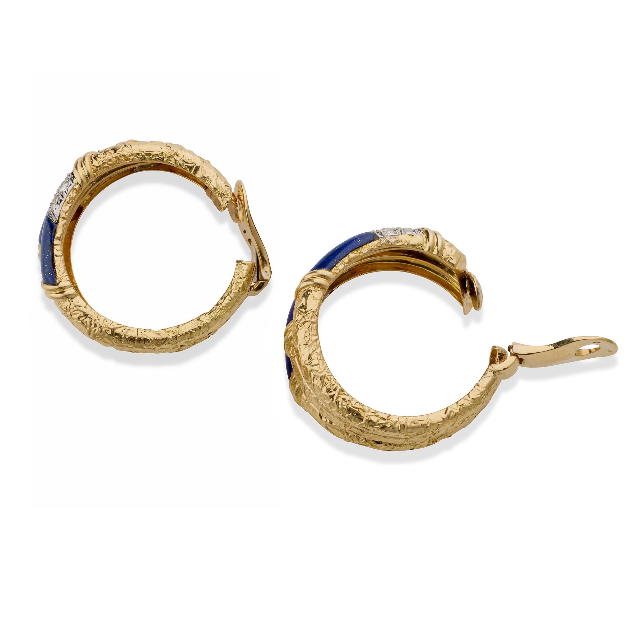 Created circa 1970, these Van Cleef & Arpels Paris hoop earrings are composed of 18K gold, lapis and diamonds. Each triple earring with omega clip backs is set with curved lapis plaques edged with fields of pave-set diamonds completed by textured