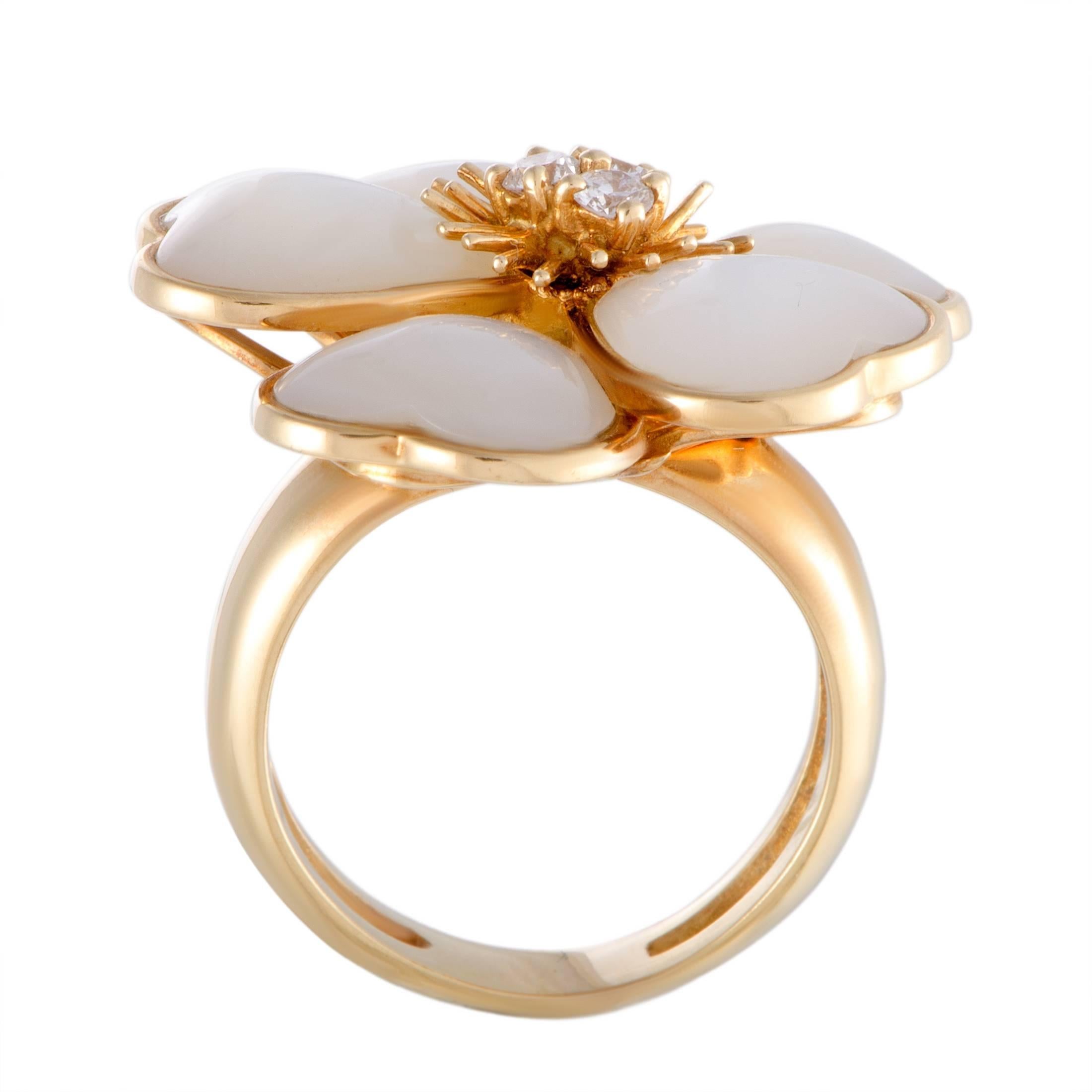 Depicting a lovely flower in an exceptionally graceful manner, this gorgeous Van Cleef & Arpels ring compels with its nifty feminine design and stylish décor. The ring is crafted from luxurious 18K yellow gold and embellished with sublime