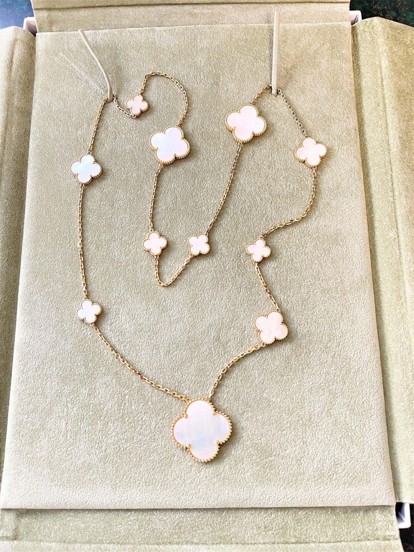 
Van Cleef & Arpels MOP Magic Alhambra Necklace In 18k yellow gold. Magic Alhambra plays with proportion, mixing and matching larger and smaller quatrefoils,
The necklace consist of 11 clover motifs of various sizes, set with white mother of pearl
