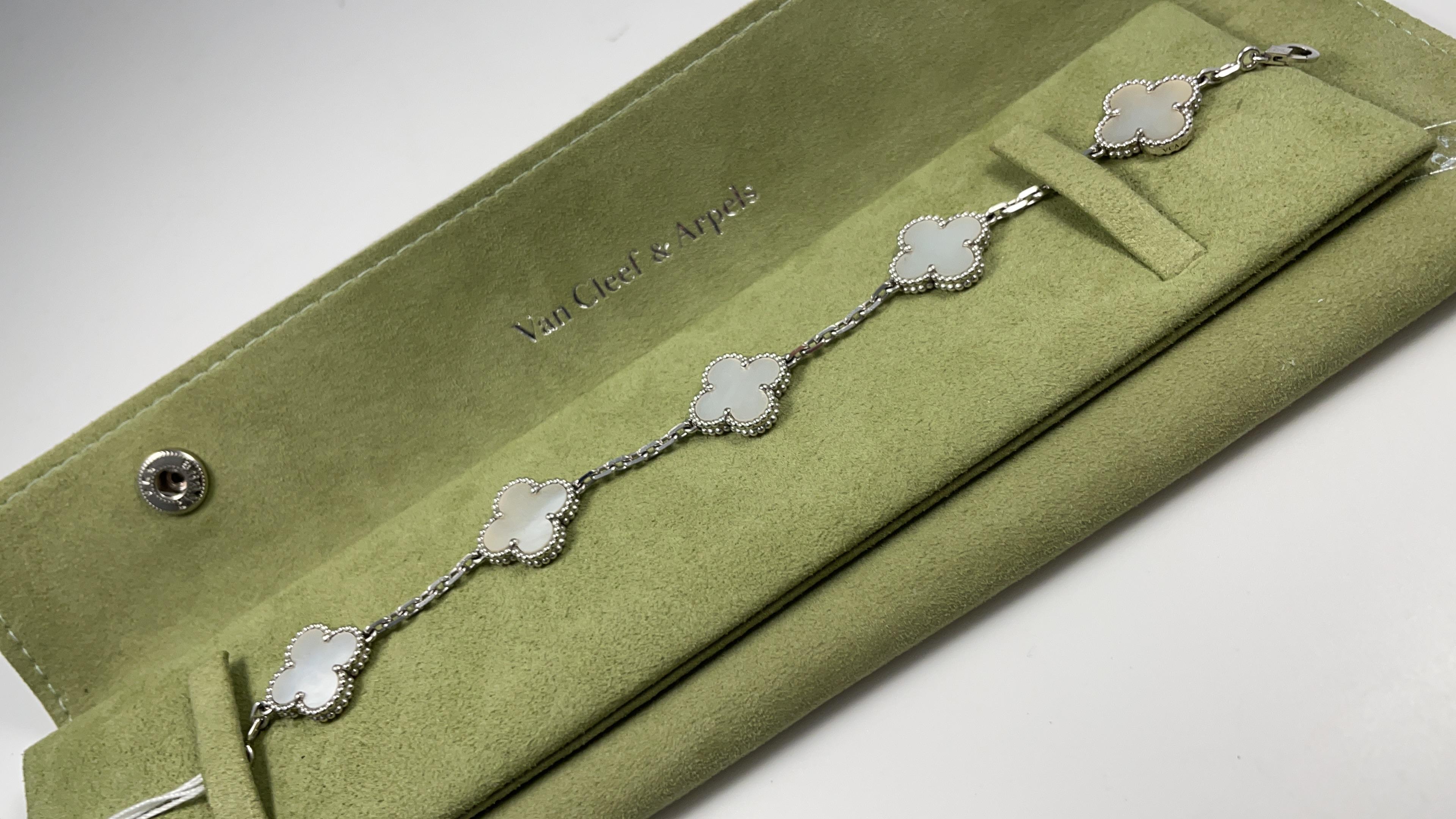Designer:  Van Cleef & Arpels

Collection:  Vintage Alhambra

Style:  Bracelet

Metal Type: White Gold

Metal Purity: 18k

Bracelet Length : 7 inches

Total Item  Weight(Grams): XX

Hallmarks: VCA; Serial #; AU750

​Includes: 24 Month Brilliance