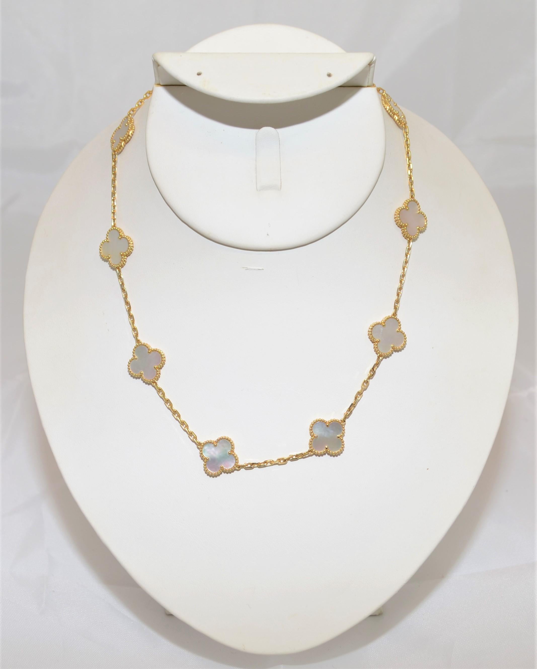 From the House of  Van Cleef & Arpels, this exceptional and finely handmade Alhambra necklace is featured in 18k gold with 10 mother of pearl clover motifs. Necklace is approximately 17 inches long, lobster clasp.