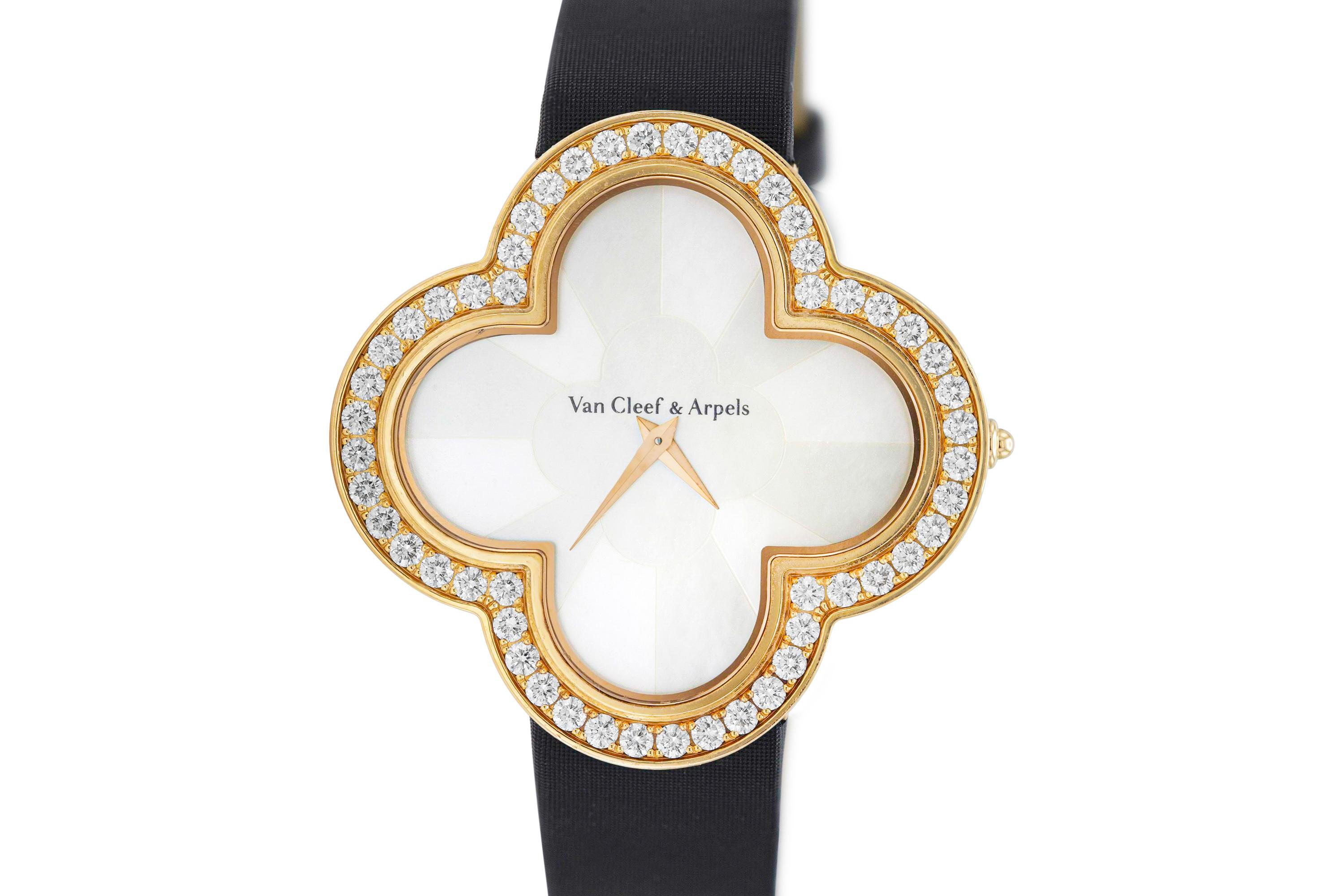 Finely crafted in 18K rose gold with mother of pearl dial and round-brilliant cut diamonds on the bezel and buckle.
Quartz movement.
40mm (large model).
Signed and numbered by Van Cleef & Arpels.