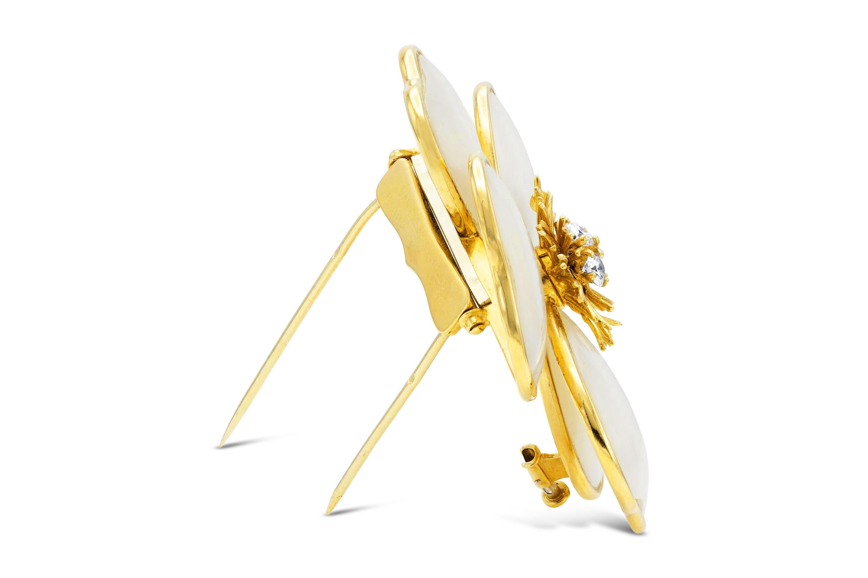 Finely crafted in 18K yellow gold with Mother of Pearl and three Round Brilliant cut Diamonds in the center weighing a total of 0.55 carat.
Signed by Van Cleef & Arpels
2 4/5 x 2 inches
