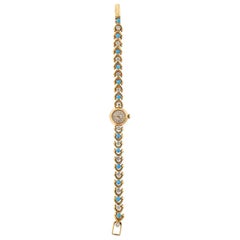 Van Cleef & Arpels Bracelet montre Movado en or avec turquoise et diamants