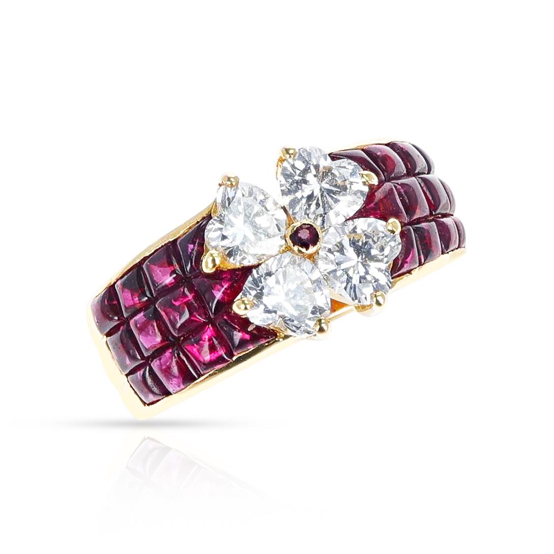 A Van Cleef & Arpels Mystery Set Ruby with Heart Shape Diamonds making a floral shape, made in 18 Karat Yellow Gold. The ring size is US 6.25. The total weight of the ring is 8.11 grams. 