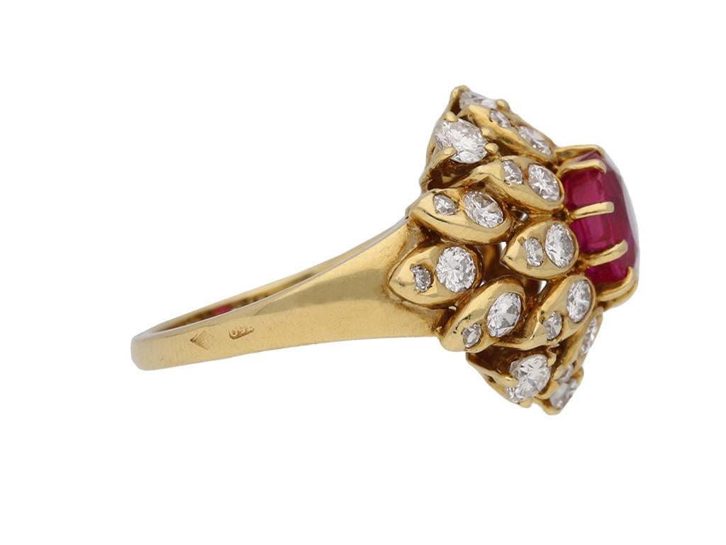 Van Cleef & Arpels natural Burmese ruby and diamond ring. Set with one central cushion shape old cut natural unenhanced Burmese ruby in an open back claw setting with an approximate weight of 1.25 carats, encircled by twenty two round brilliant cut