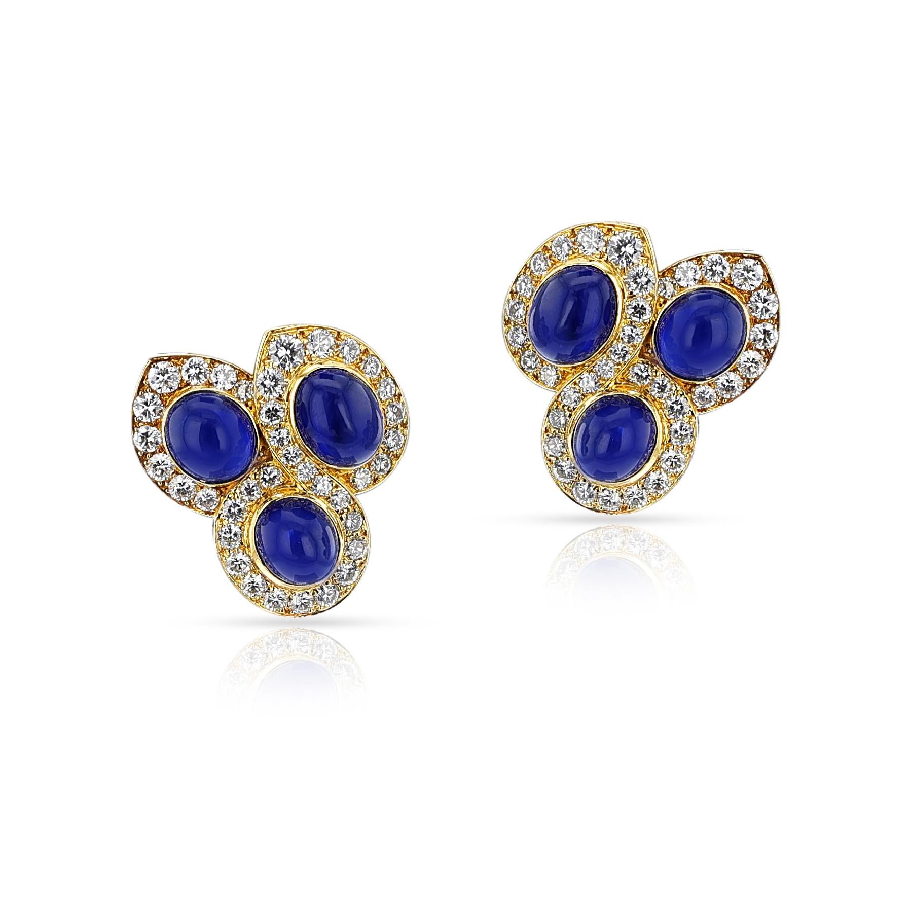 A pair of Van Cleef & Arpels Natural Sapphire Cabochon and Diamond Earrings made in 18k Yellow Gold. Signed and numbered. The total weight is 20.30 grams and the length is 1 inch and the width is 0.95 inches. 