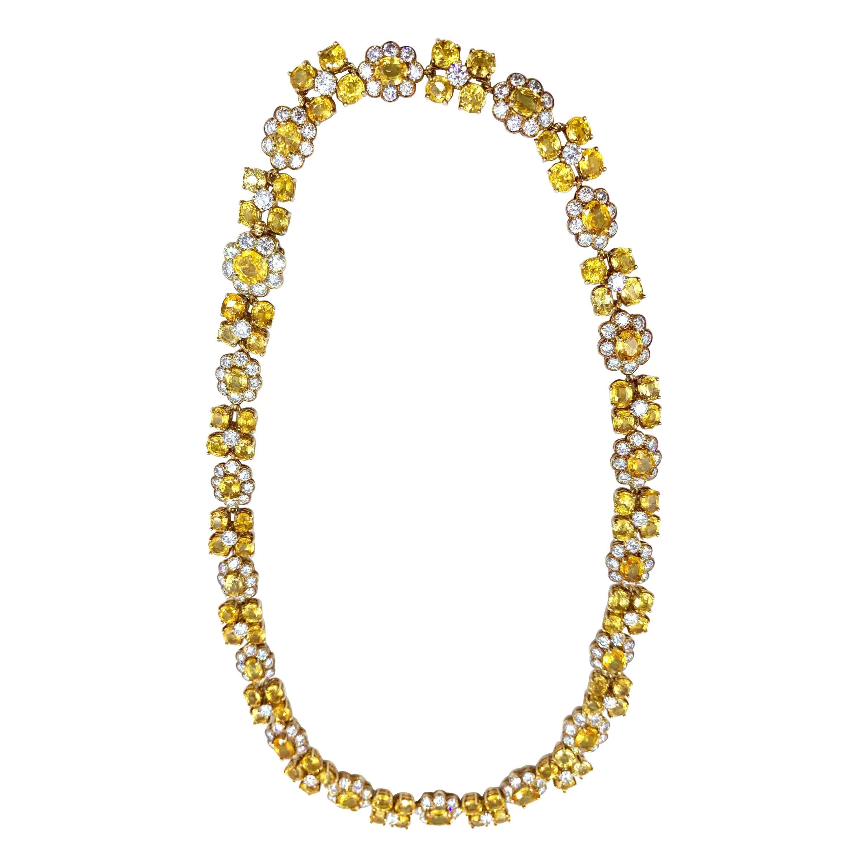 A natural yellow Ceylon sapphire diamond necklace by Van Cleef & Arpels. The necklace is beautifully finished in 18kt yellow gold followed by a pattern of sapphires and diamonds. The necklace is 17.50 in long. The Yellow Sapphire is 65.0 carats and