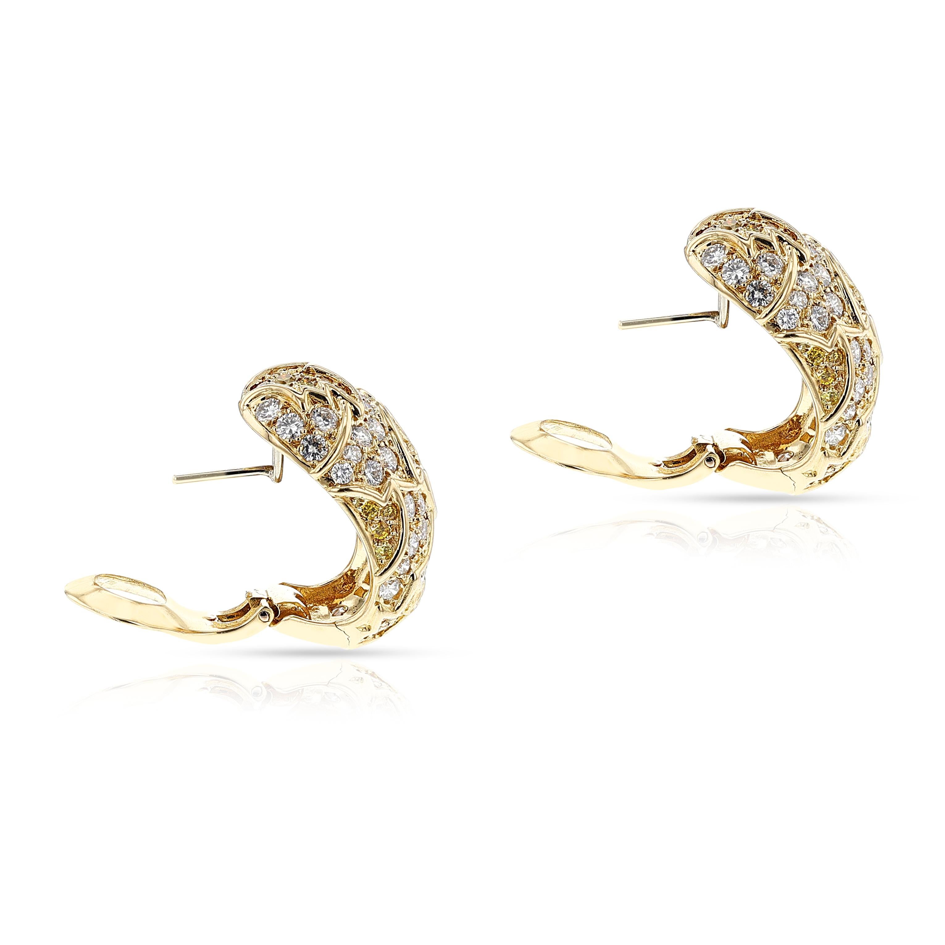 A highly chic natural yellow and white diamond necklace and earring set by Van Cleef & Arpels. The necklace and matching pair of earrings are designed with alternating floral patterns, set in 18k yellow gold with natural round brilliant-cut yellow