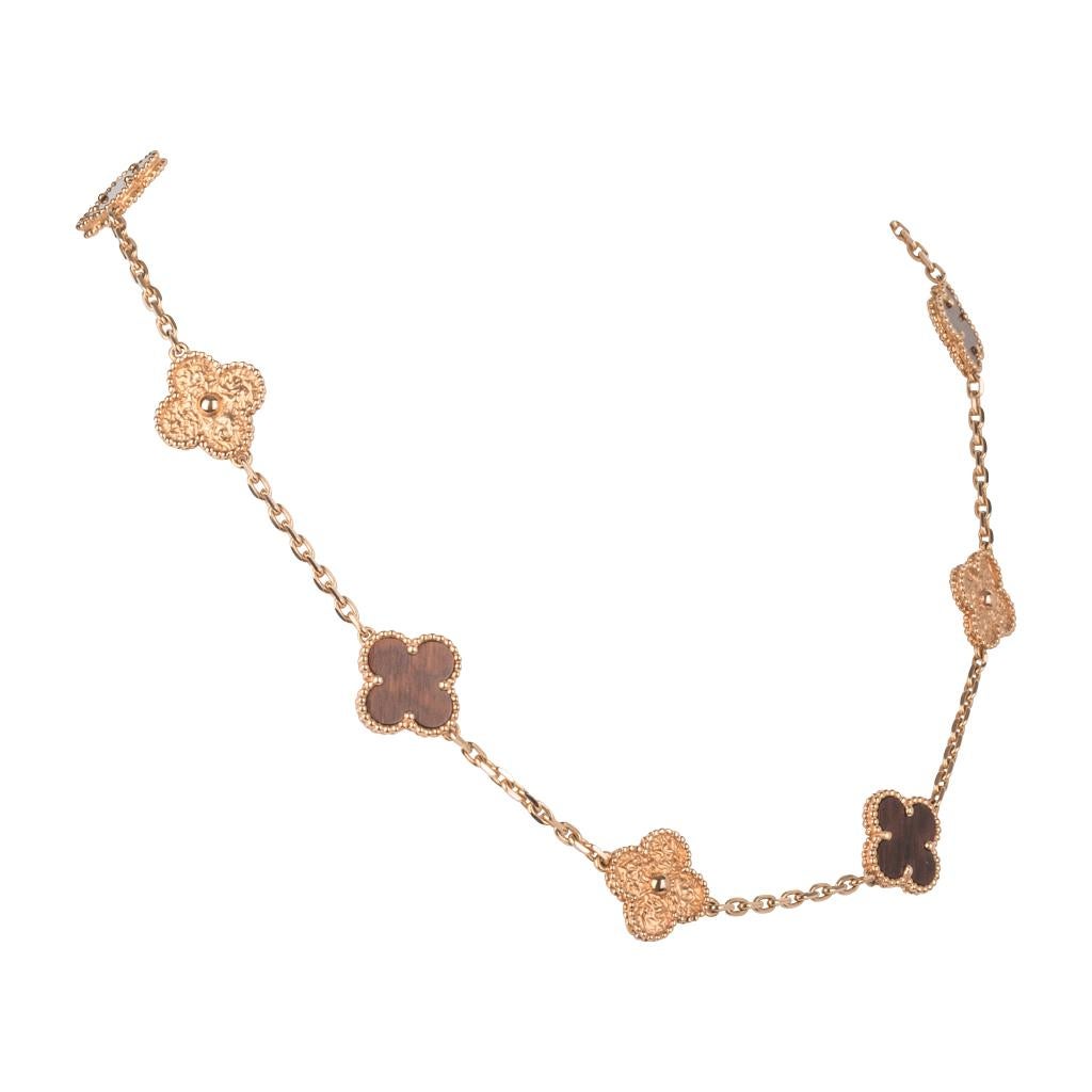 Extremely are and highly collectable Alhambra Collection necklace in 18K Rose Gold and Bois d'Amourette (letterwood).
Vintage and aged to perfection this series is created by a French craftsman using antique machinery dating back to the era of Louis