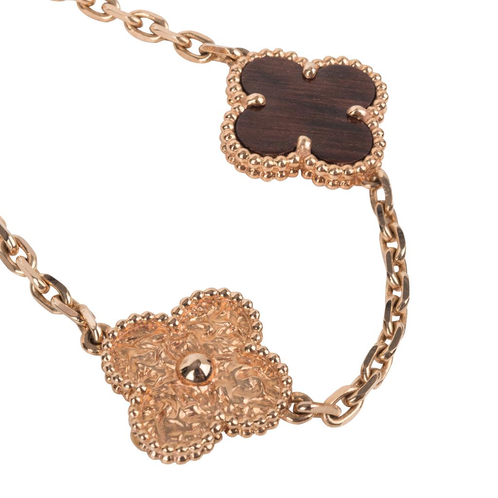 Mightychic offers an extremely rare and highly collectible Vintage Alhambra Collection necklace featured in 18K Rose Gold and Bois d'Amourette (letterwood).
Vintage and aged to perfection this series is created by a French craftsman using antique