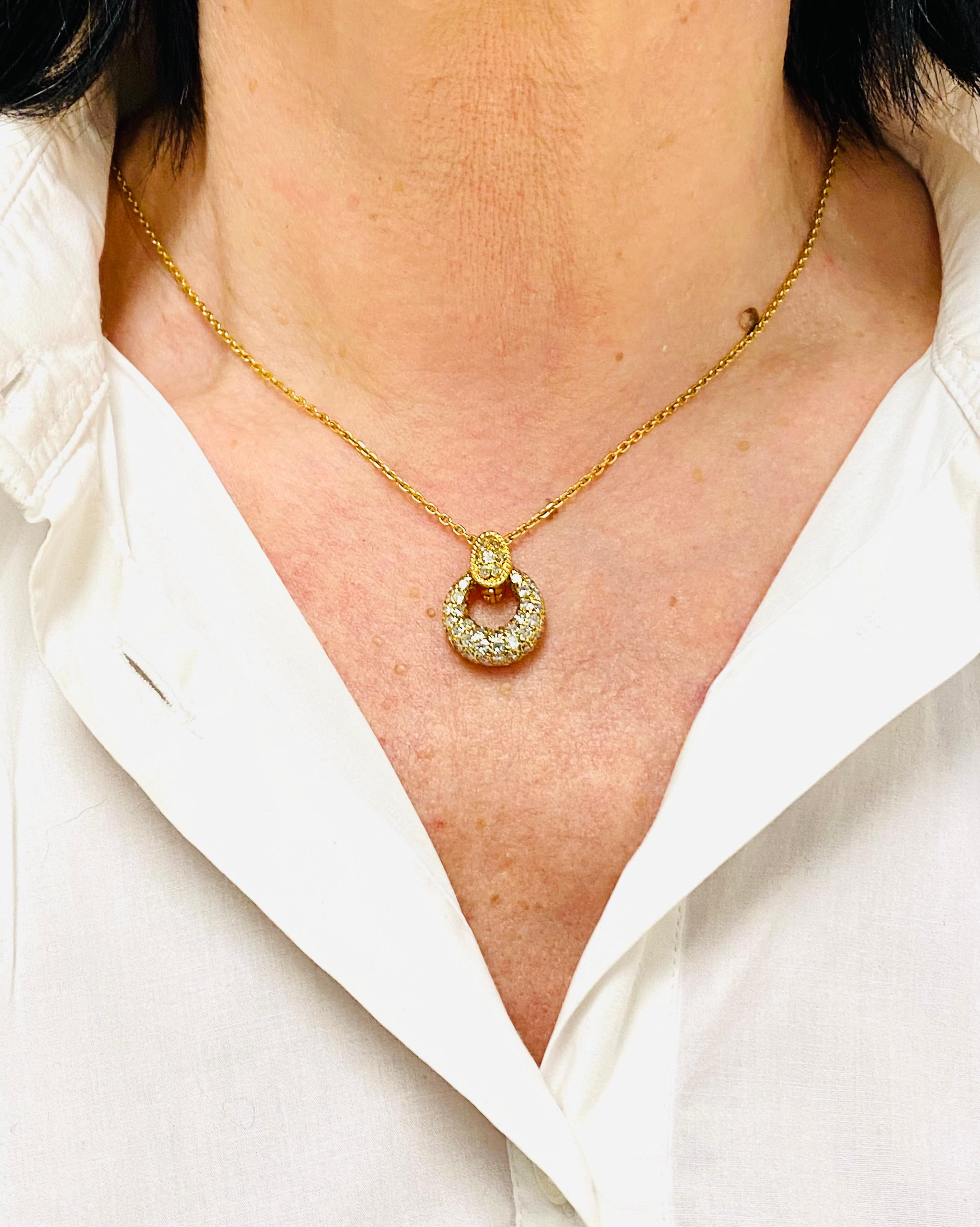 

A diamond necklace by Van Cleef & Arpels made of 18k gold.
The necklace comprises a thin chain and a pendant that is assembled with a hinged lock and a
drop element. The latter can be interchangeable. The pendant is embellished with a