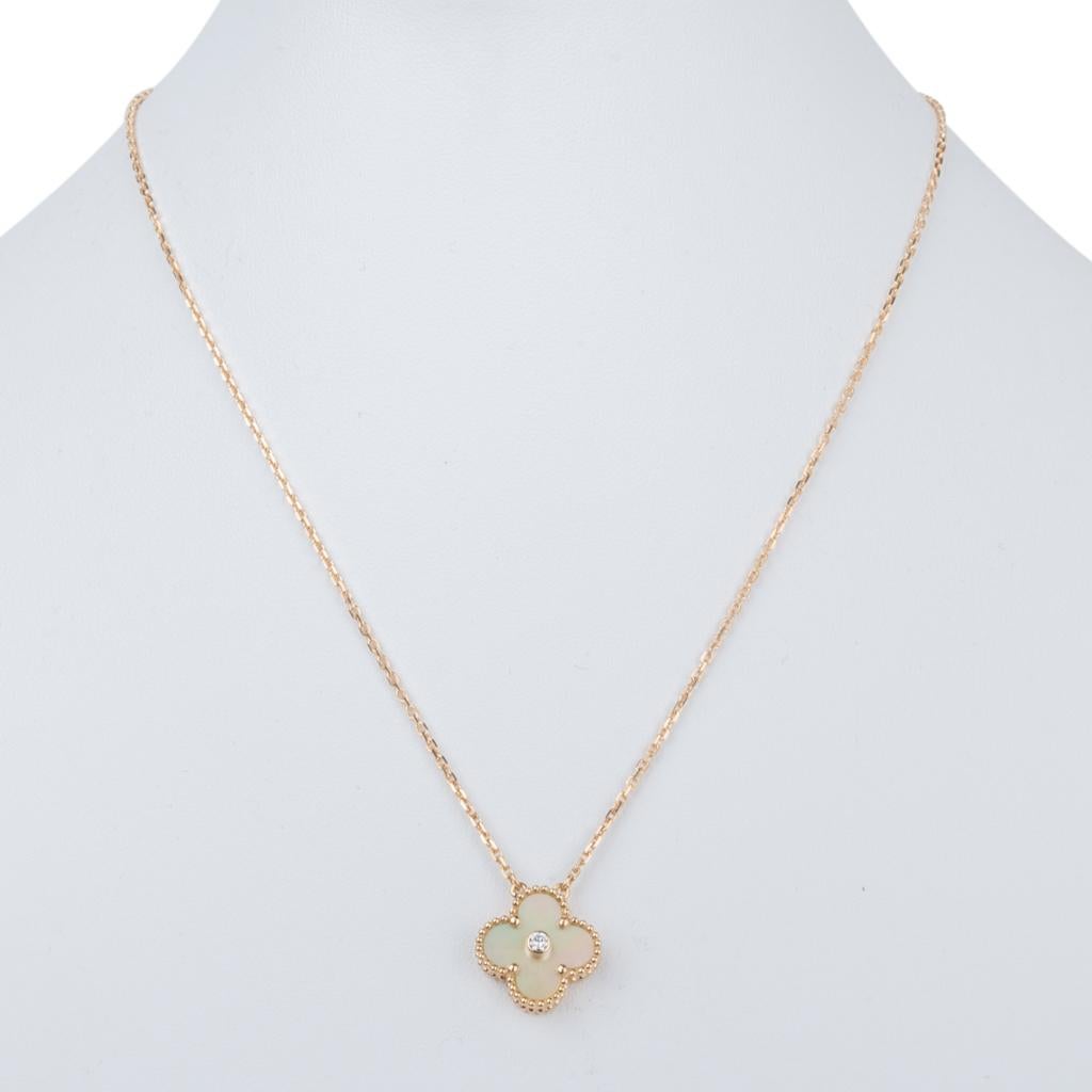 Guaranteed authentic  extremely rare and highly collectible Van Cleef & Arpels Vintage Alhambra Holiday necklace features gold Mother of Pearl with round center set diamond.
Limited Edition.
Set in 18K yellow Gold.
This charming Alhambra comes with