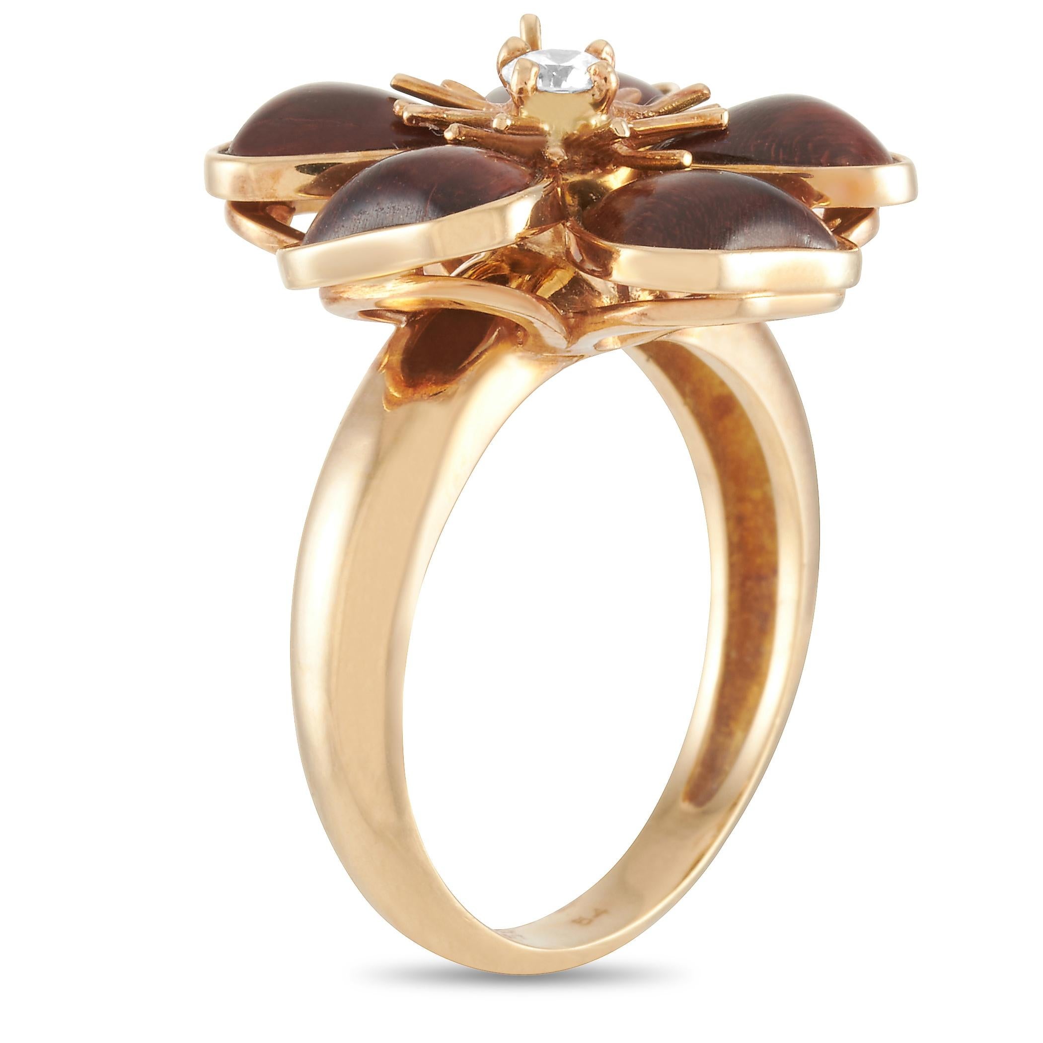 The Van Cleef & Arpels “Nerval” ring is made of 18K yellow gold and set with wood and a diamond stone. The ring weighs 8.1 grams and boasts band thickness of 4 mm and top height of 8 mm, while top dimensions measure 20 by 20 mm.
 
 This jewelry