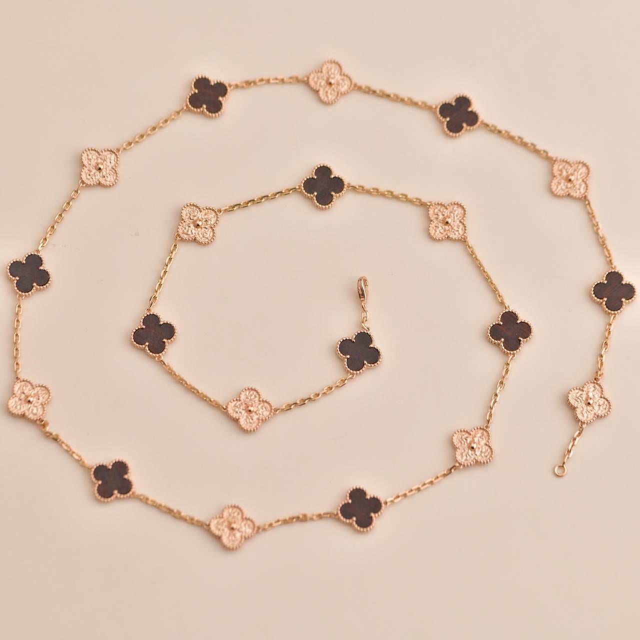 Van Cleef & Arpels Numbered Edition Bois D’amourette Rose Gold 20-Motif Necklace In Excellent Condition In Banbury, GB